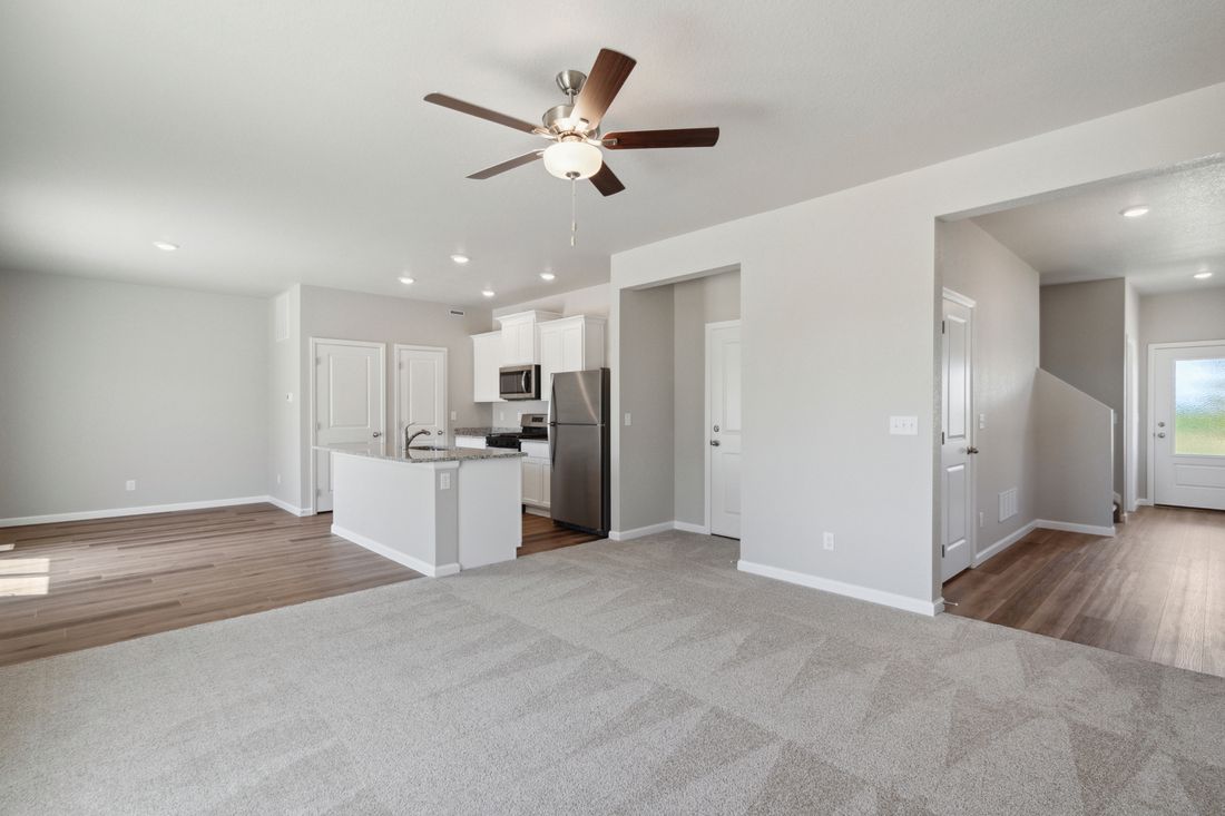 The family room sits right off of the kitchen and dining room creating an open-concept layout.