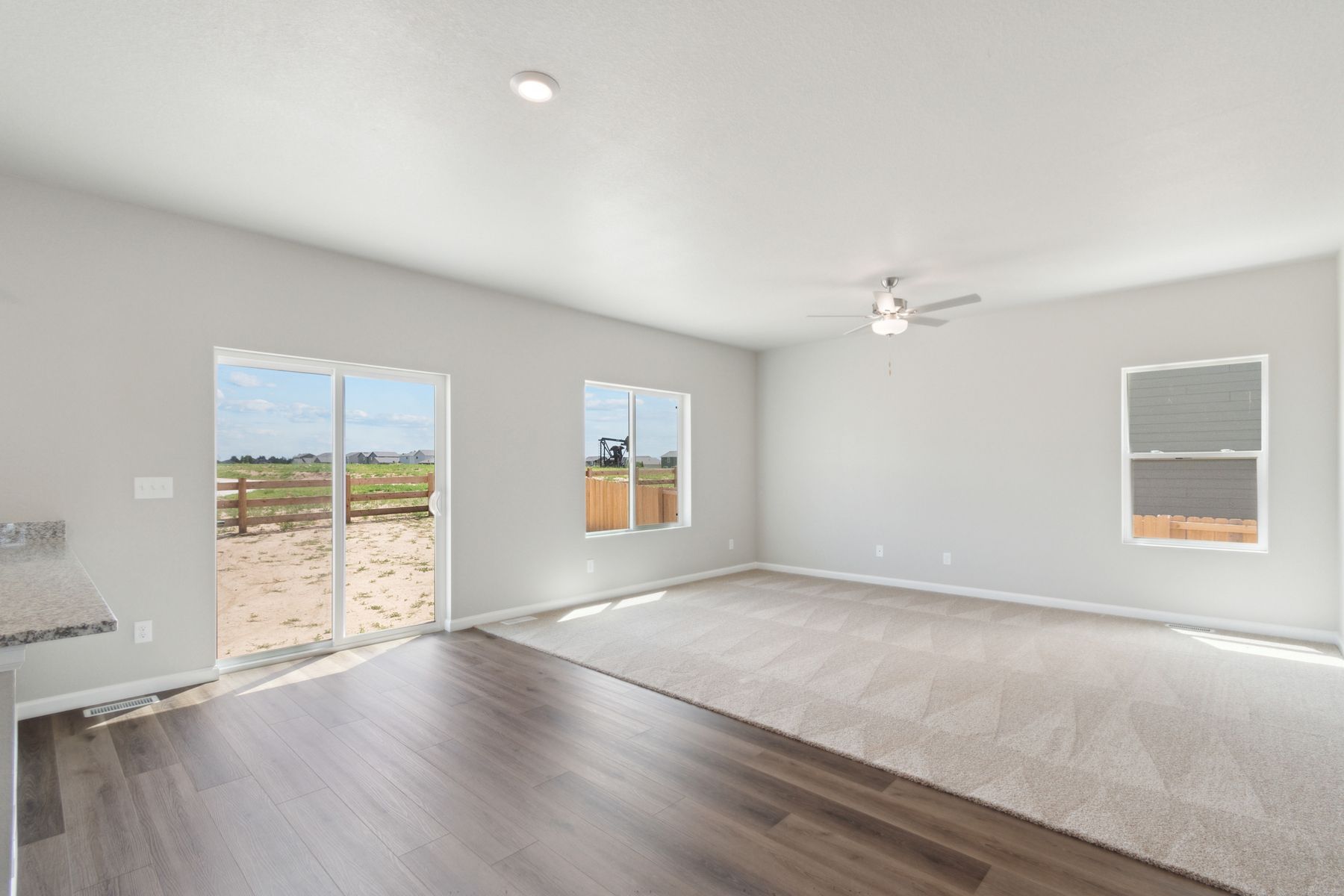 The family room is spacious and has plenty of room for furniture.