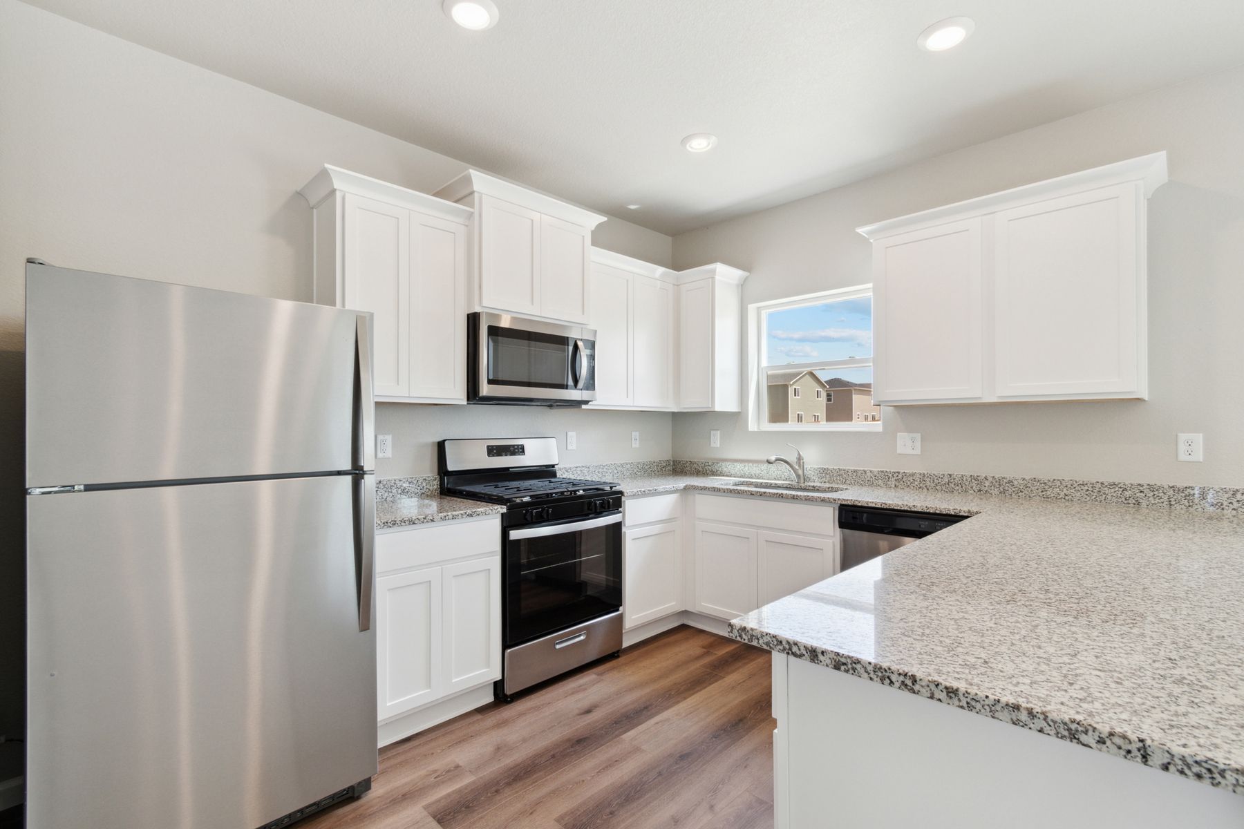 The kitchen of the Laramie has sprawling granite countertops.