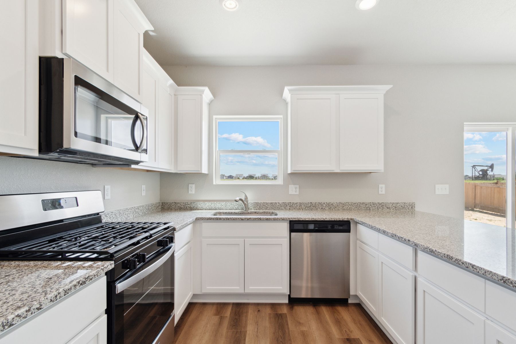 The dining room and family room of the Laramie sits right next to the kitchen.