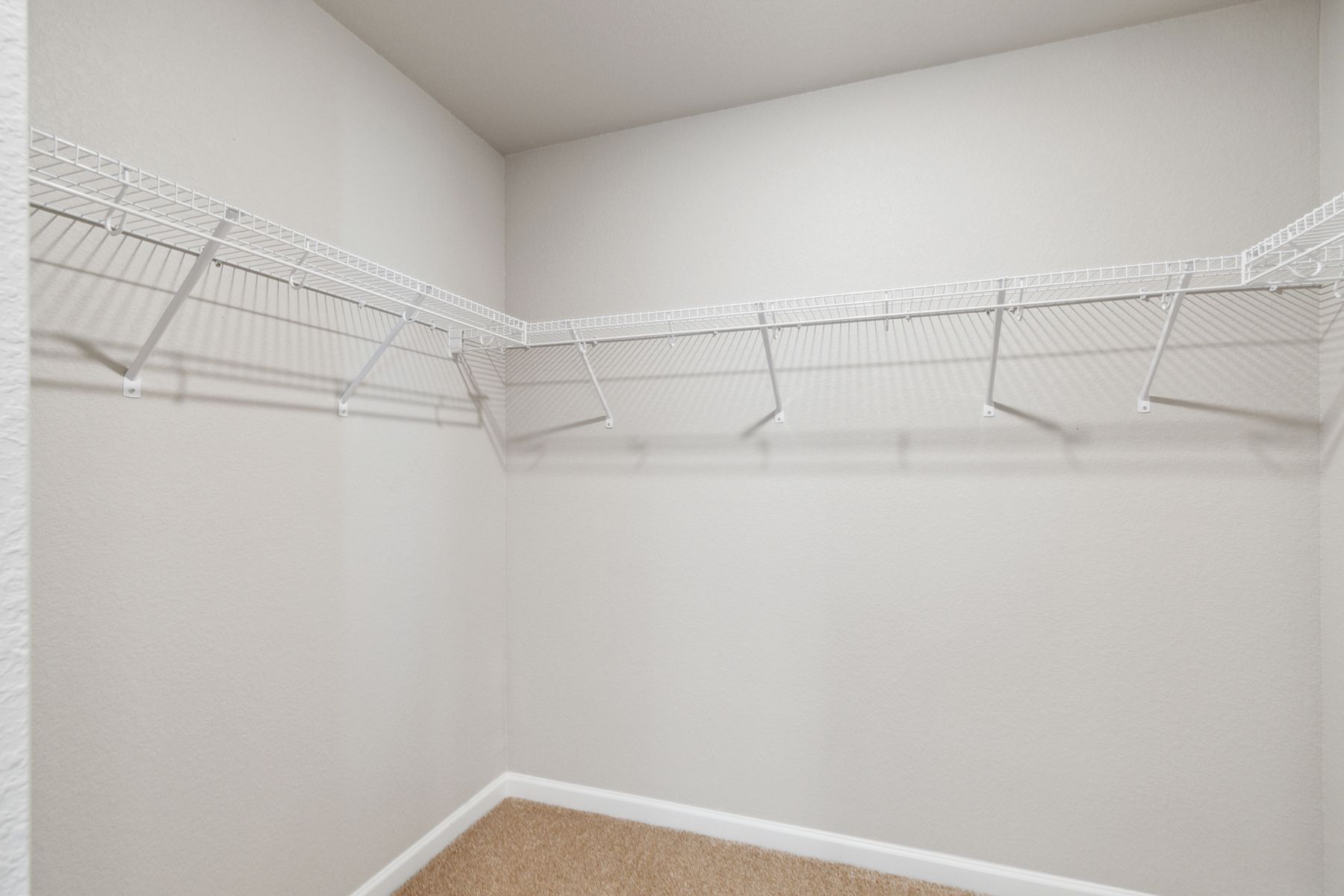 The master, walk-in closet of the Laramie is spacious enough for all of your clothes, shoes and other personal storage needs.