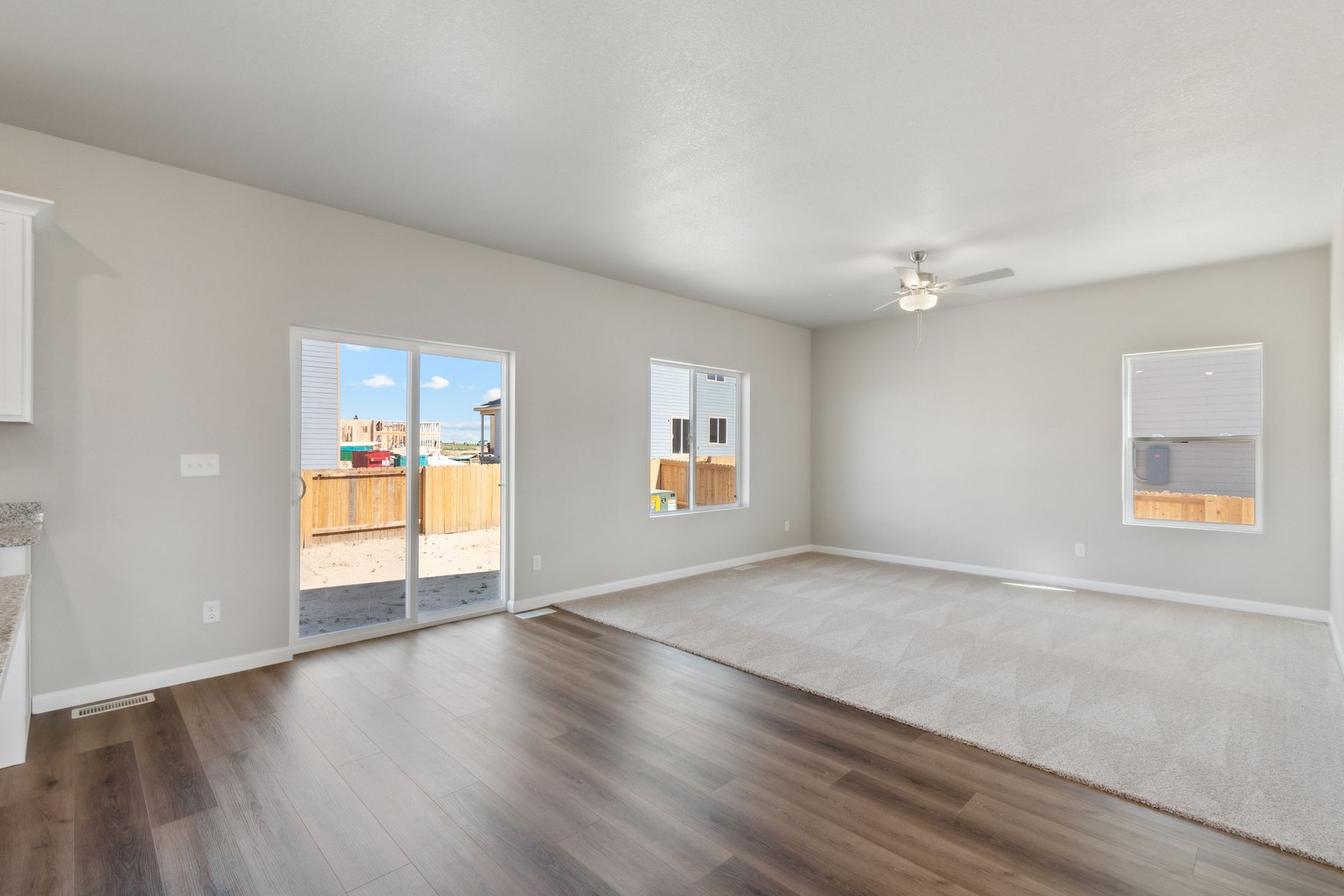 The sliding glass doors in the dining room allow for great natural light.