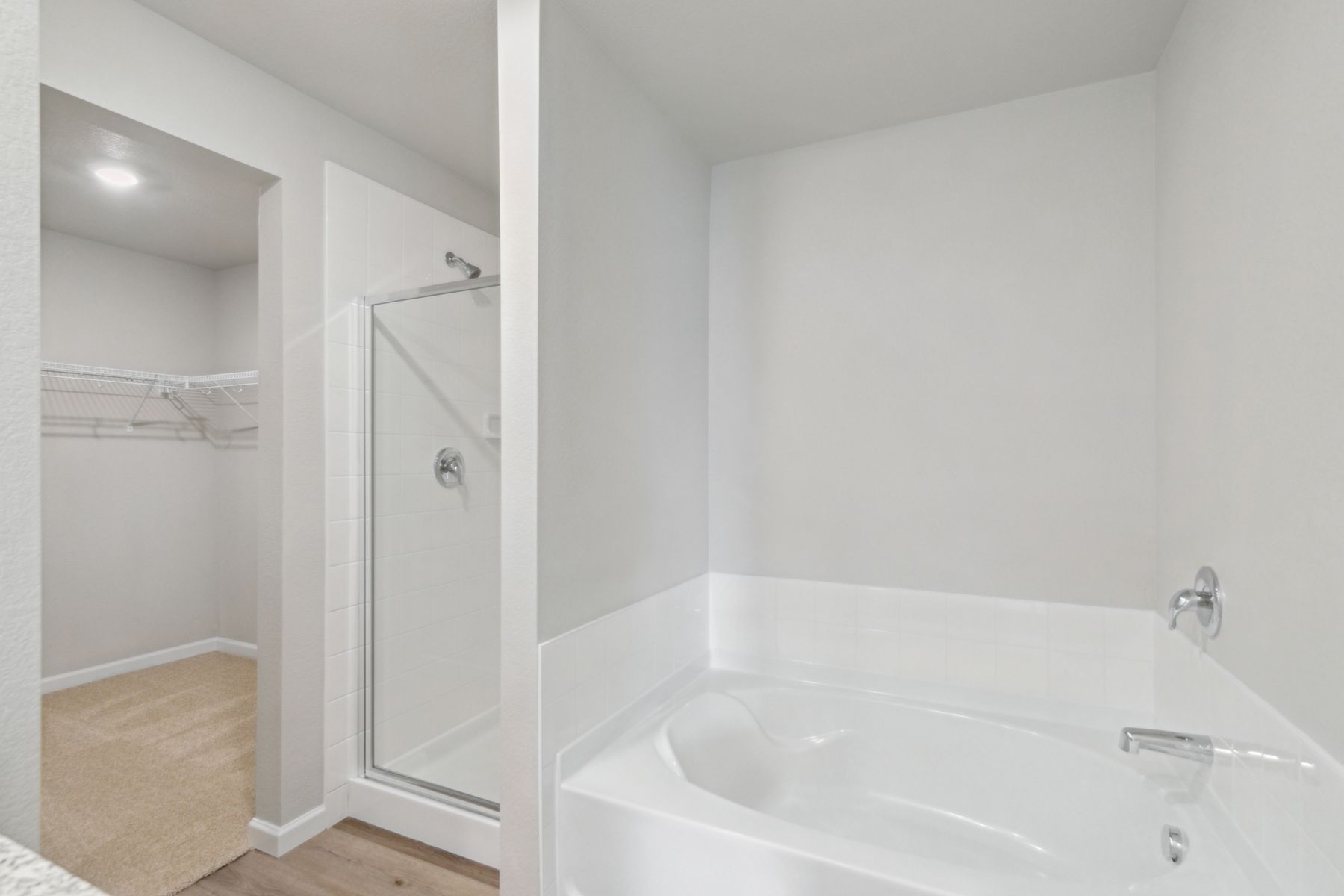 The master bathroom of the Rio Grande has a garden tub and glass walk-in shower.