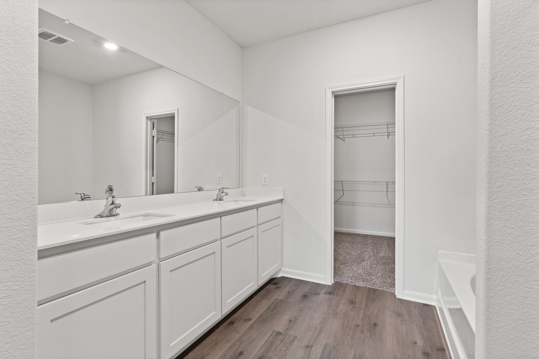 The master bathroom of the Cypress has a large vanity with dual sinks.