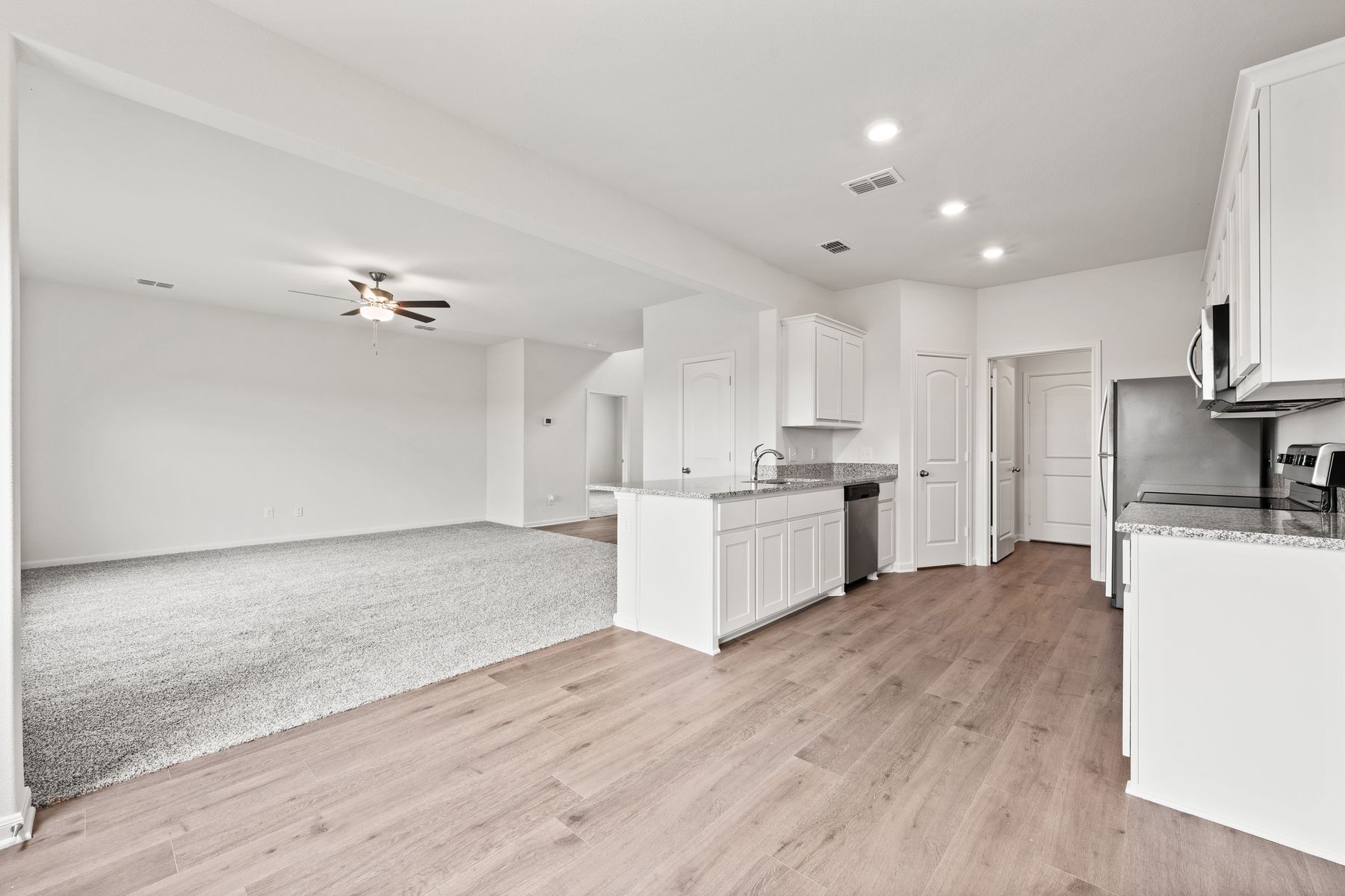 The kitchen of the Cypress sits in between the family room and dining room.