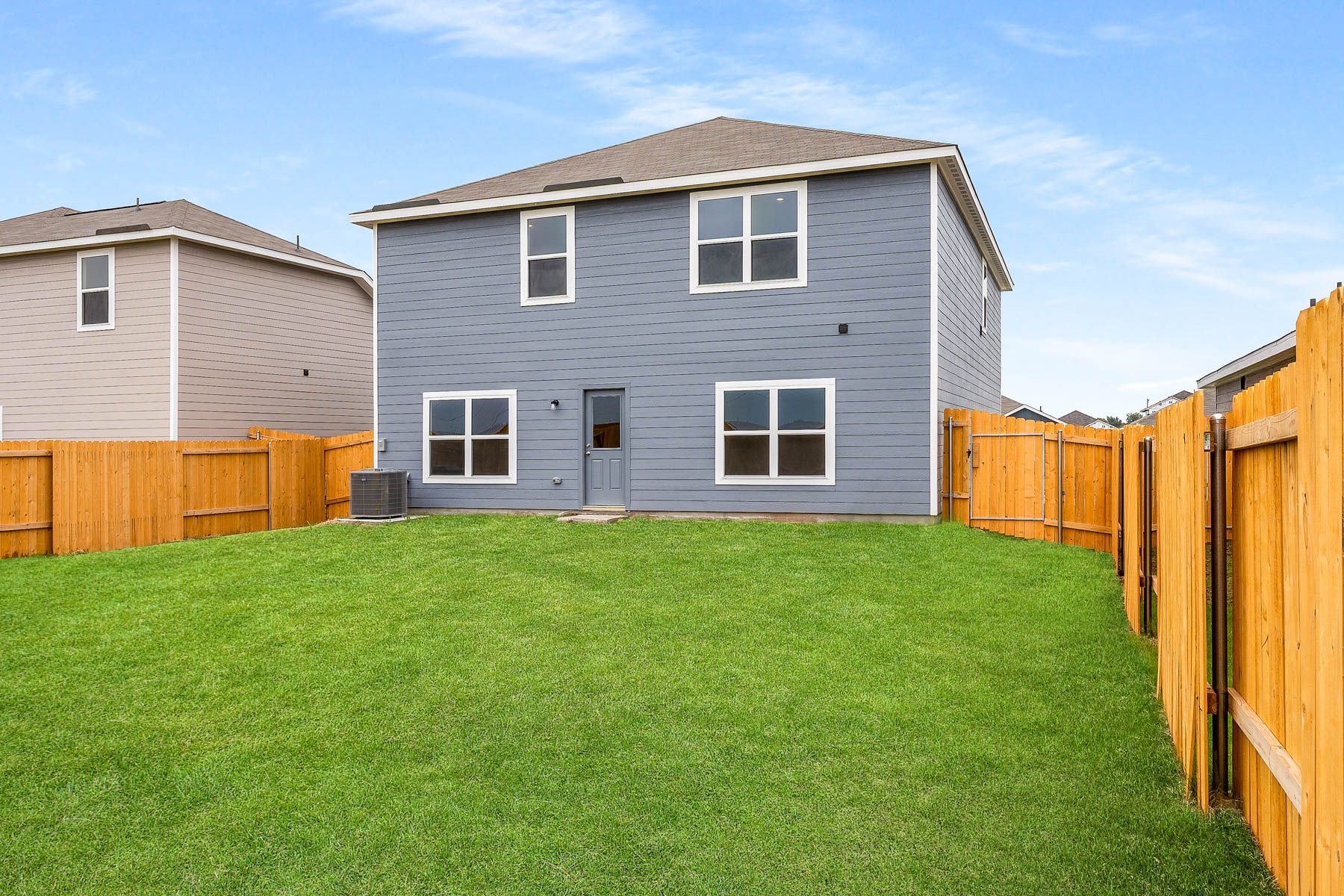 The back yard of the Driftwood is a fully fenced-in.