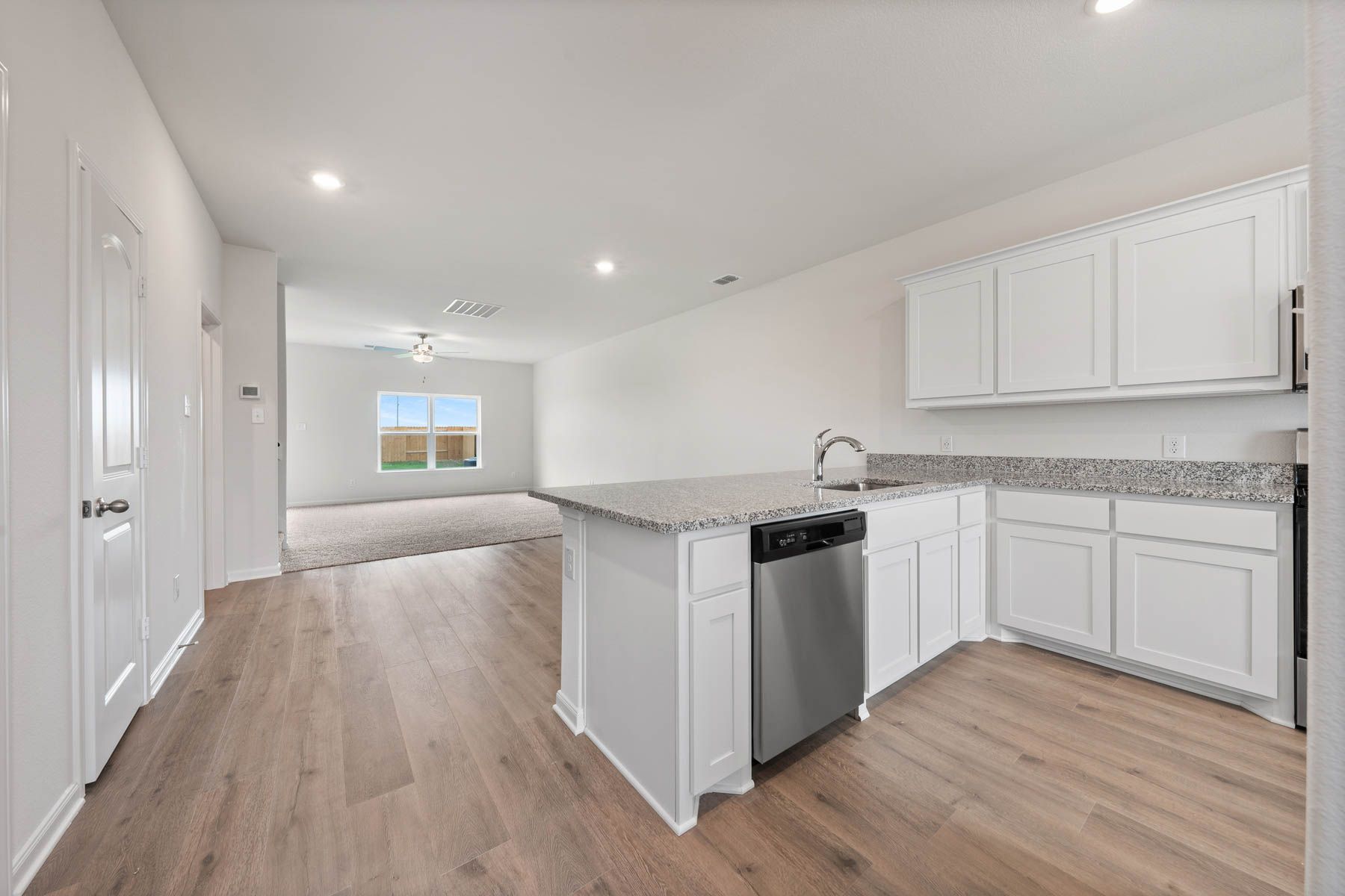 The dining room of the Driftwood sits in betweent the kitchen and the family room.