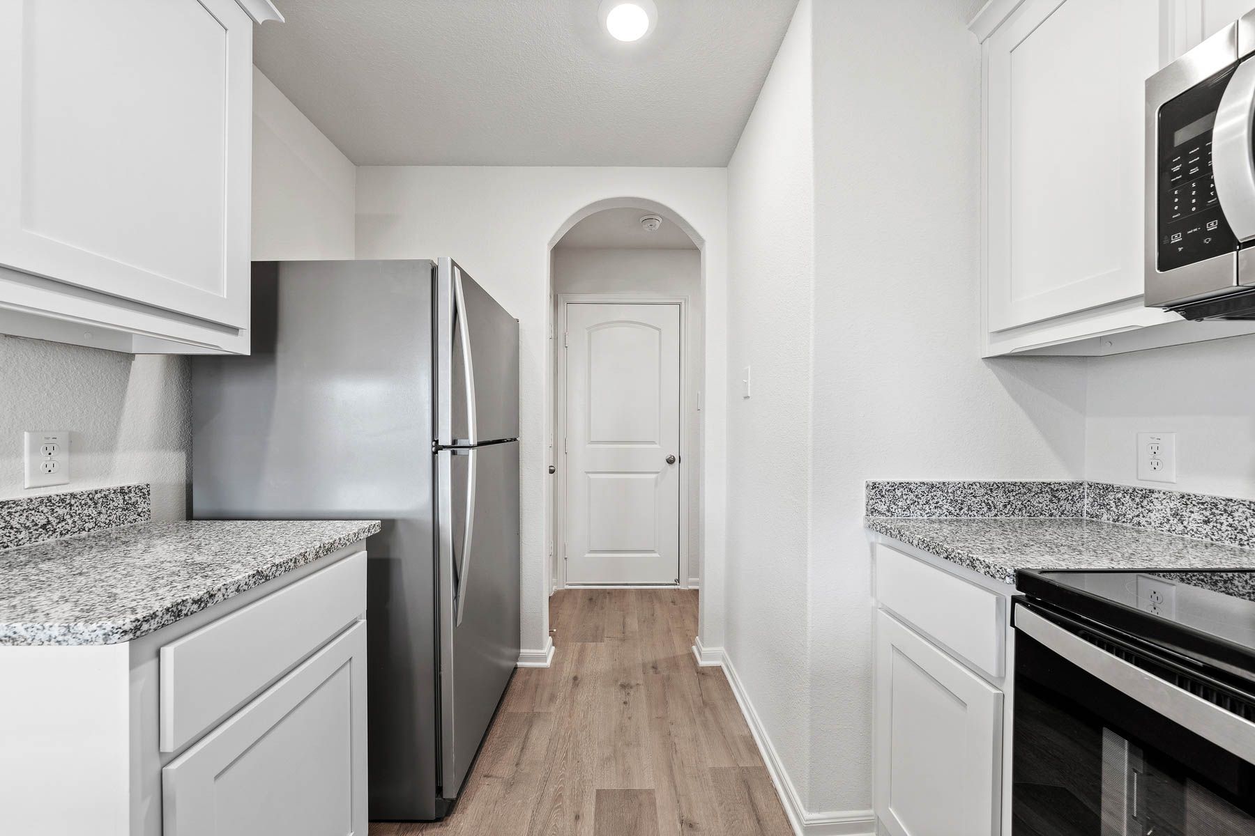 The kitchen of the Rio Grande has white wood cabinets.