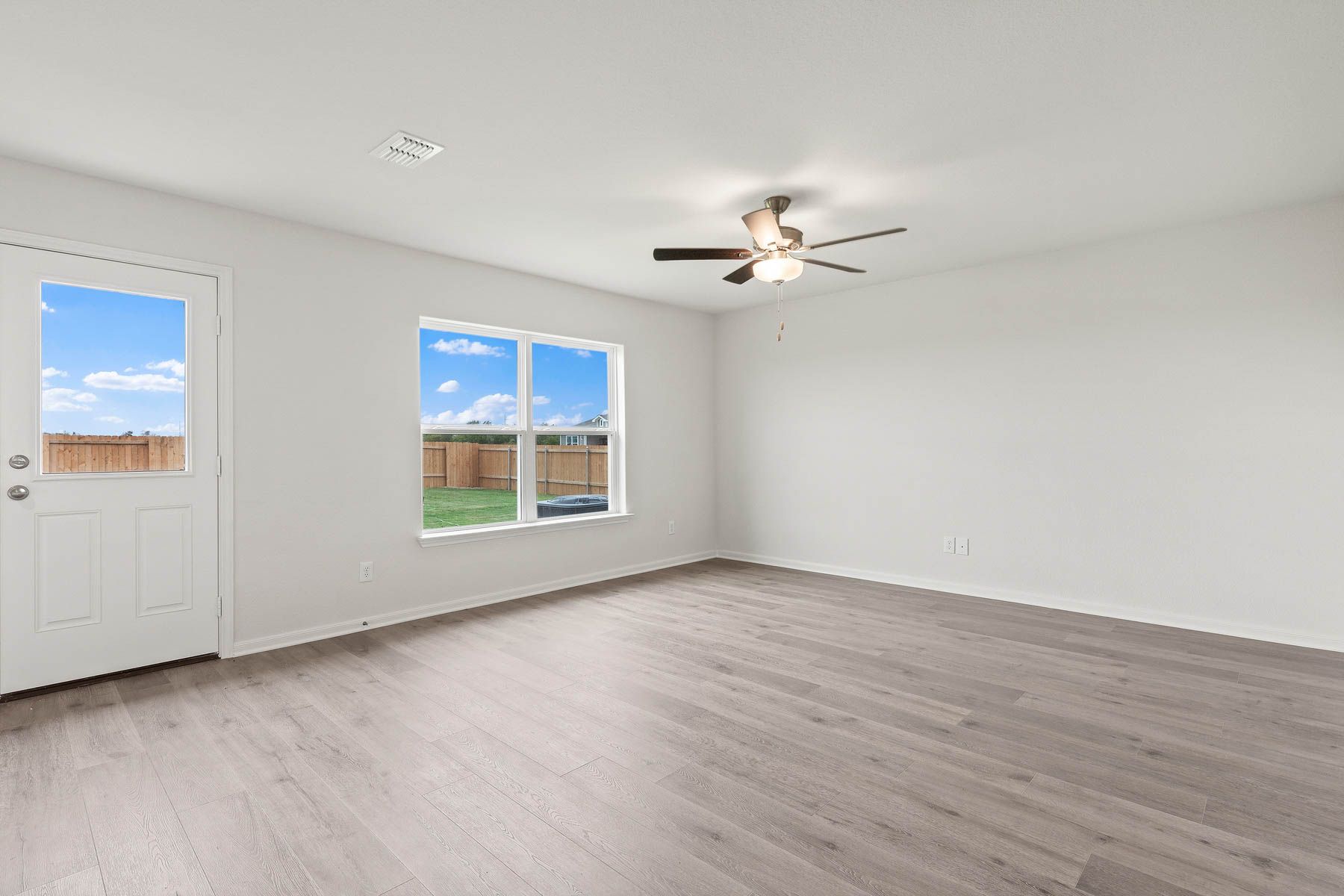 The family room of the Rio Grande has a large window with backyard views.