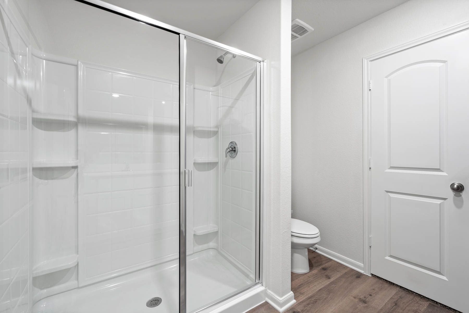 The master bathroom has a glass, walk-in shower.
