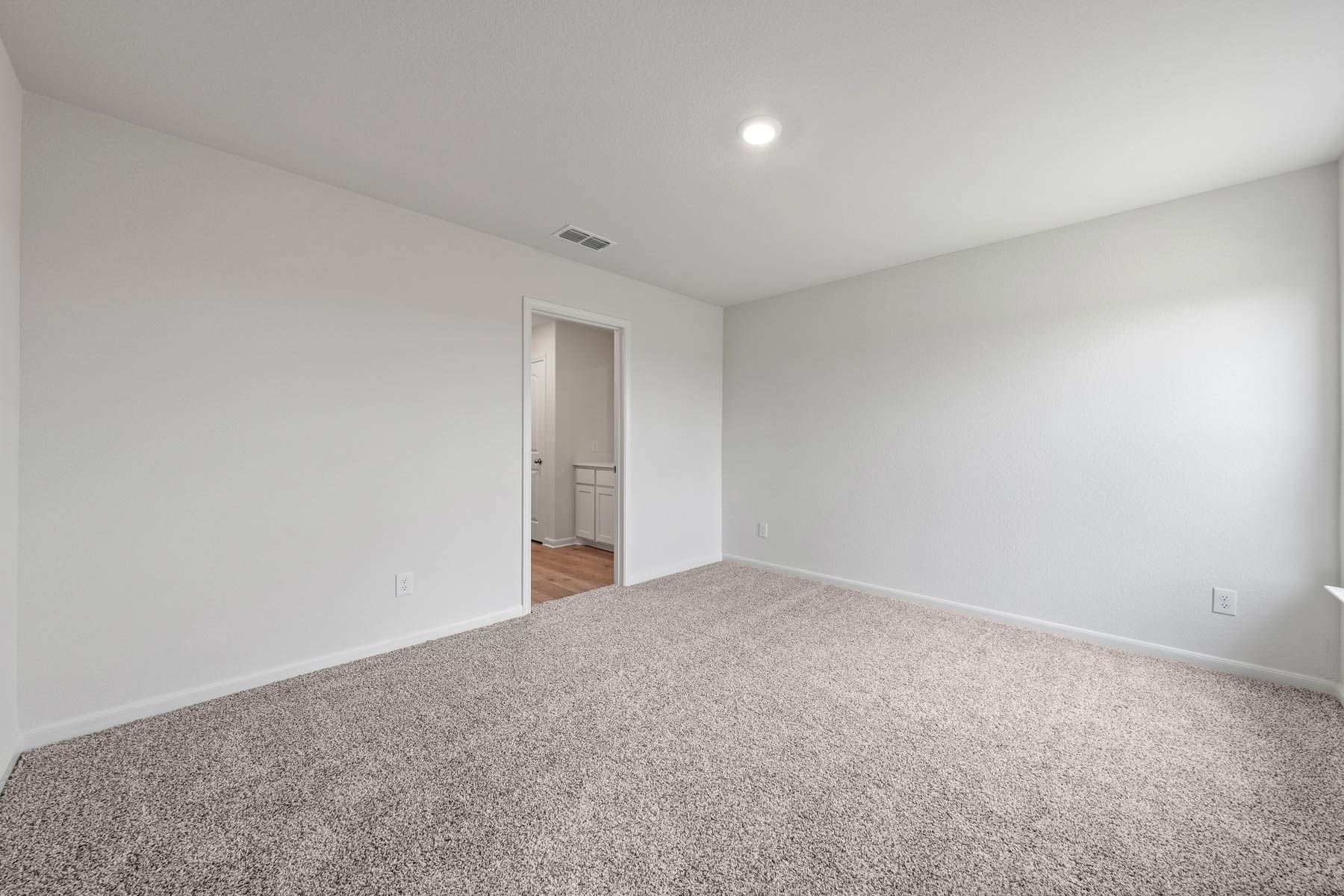 The master suite has plenty of space for king-size furniture.