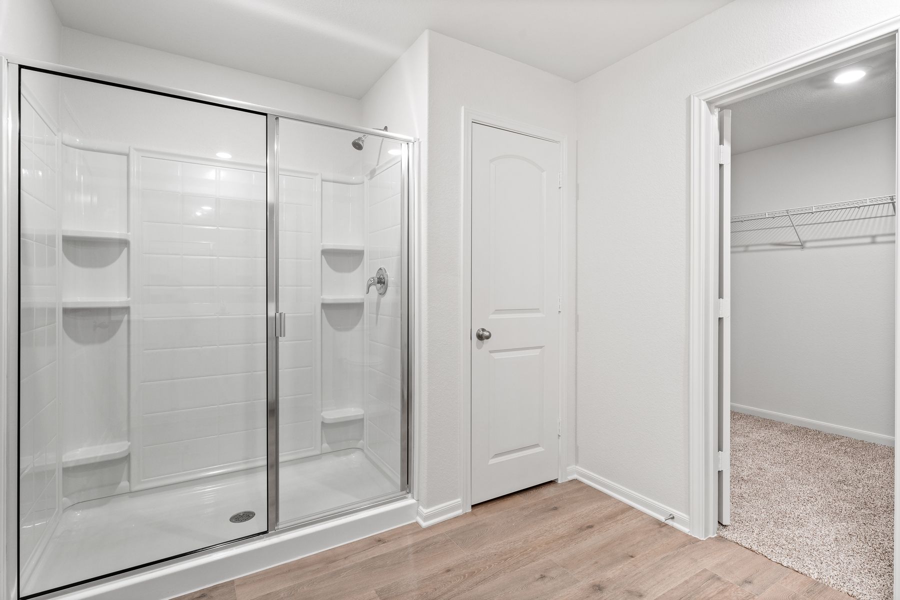 The master bathroom of the Blanco has a large walk-in, glass shower.