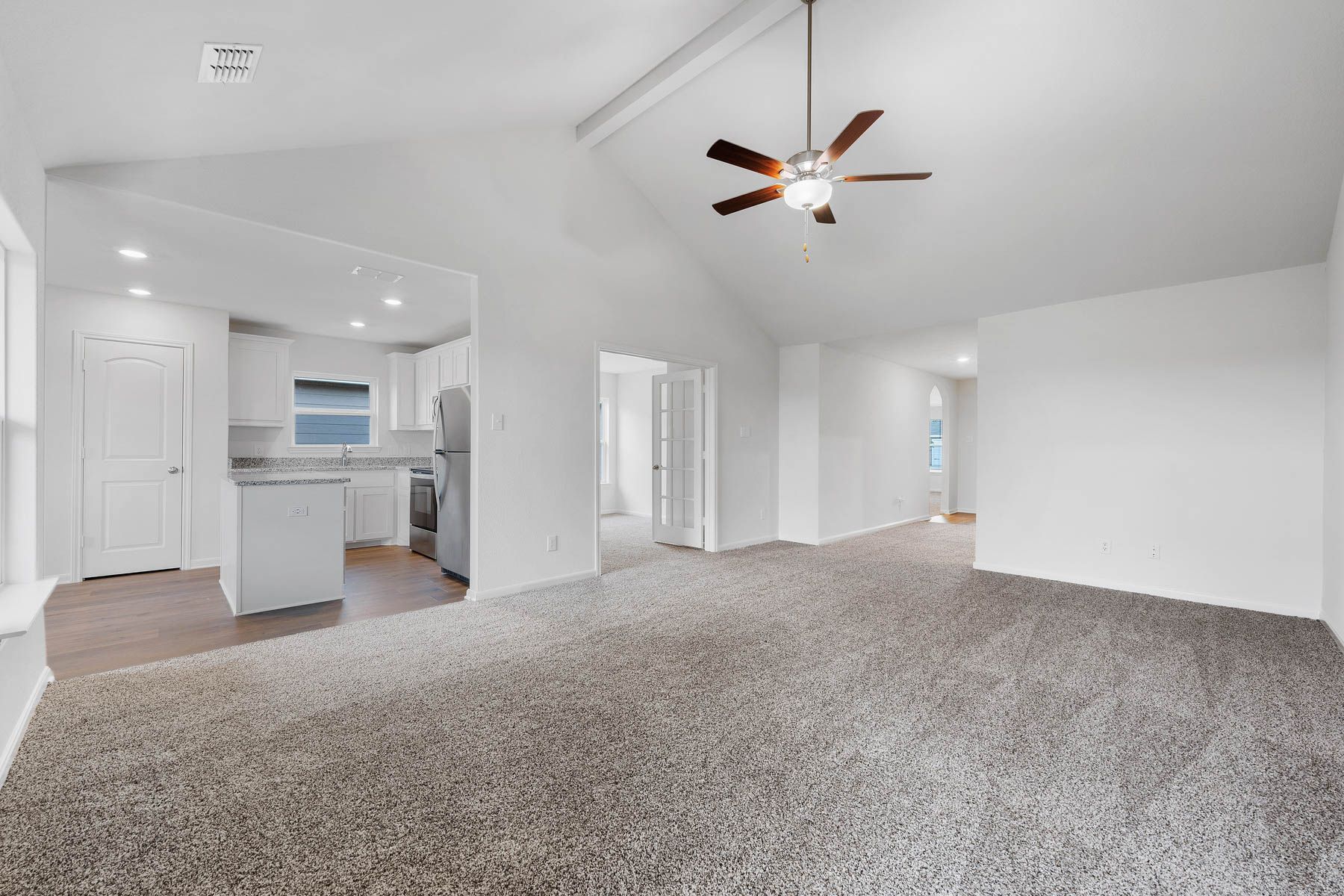 The family room of the Sabine sits adjacent to the kitchen.