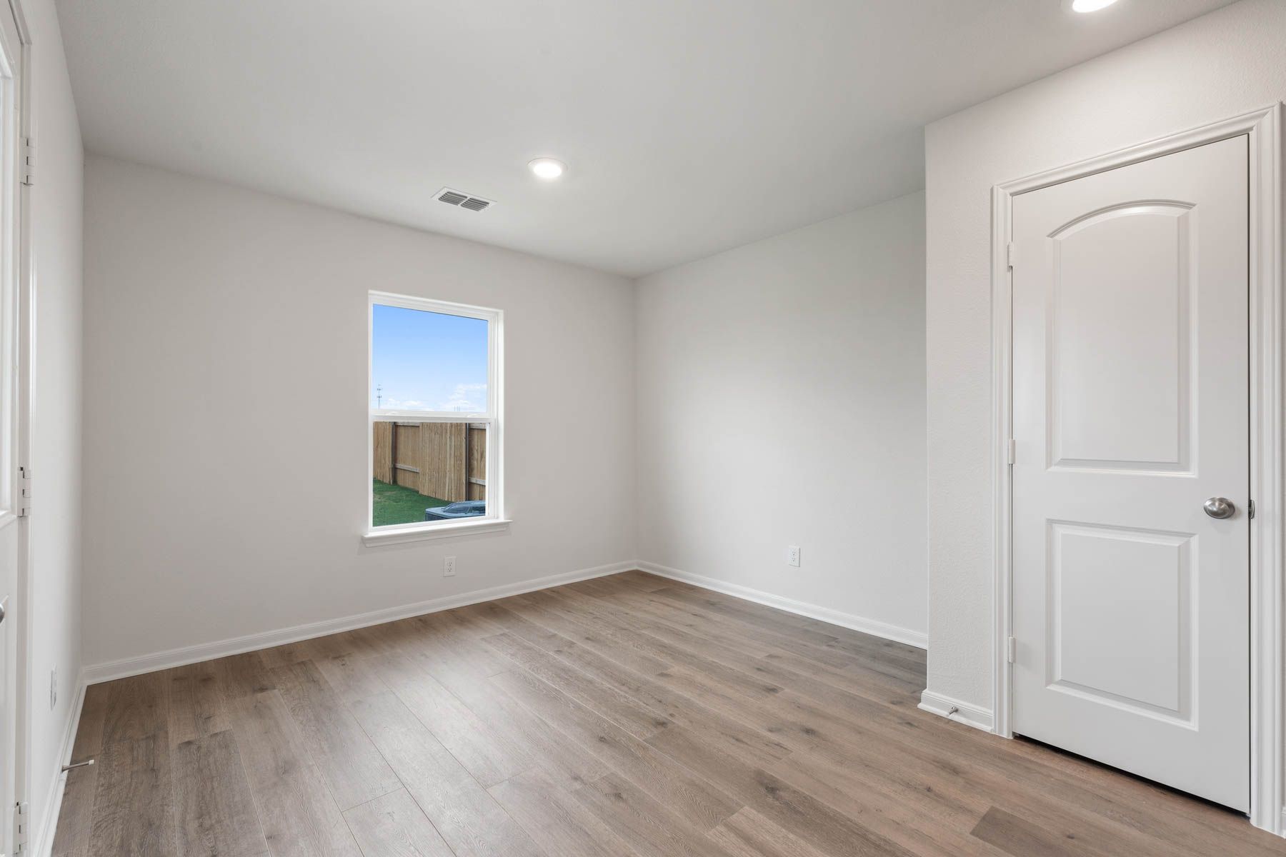 The dining room has a large window that lets in great natural light.