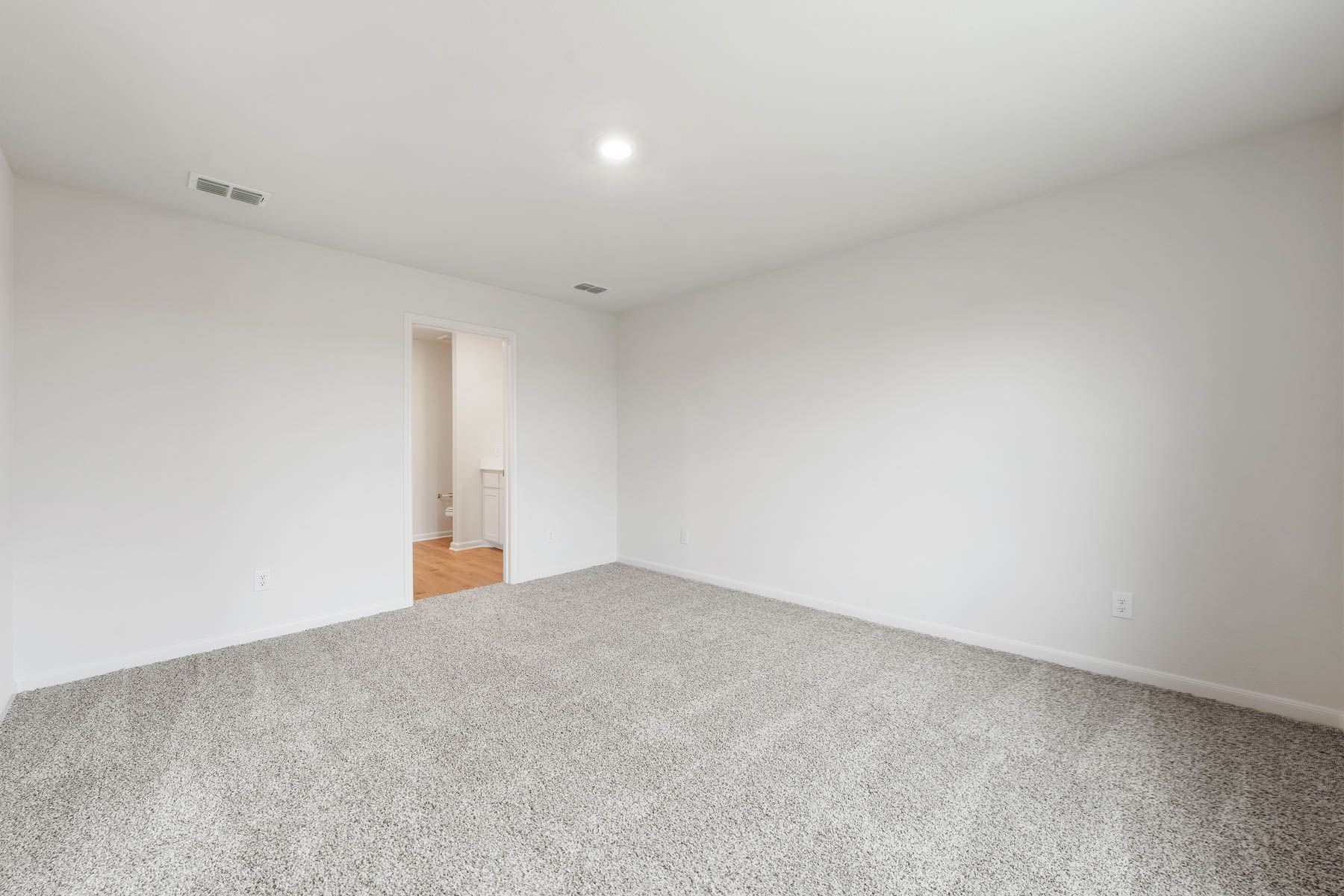 The master suite has a bedroom, private bathroom and walk-in closet.