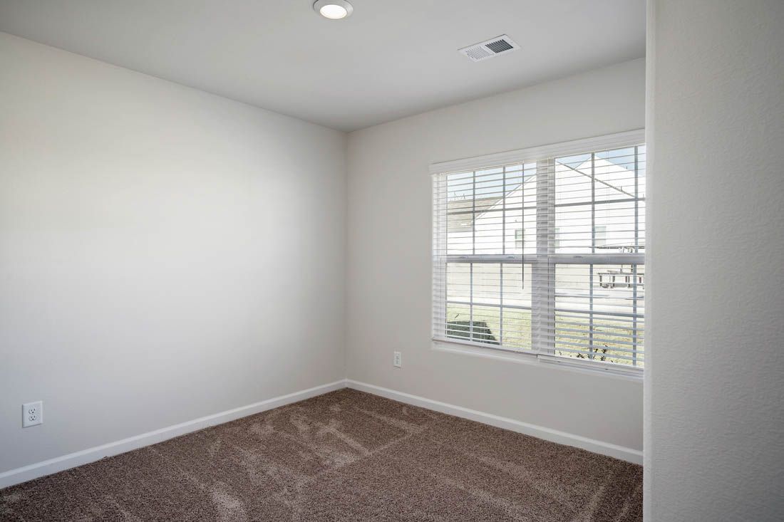 Bedroom has large window for natural light