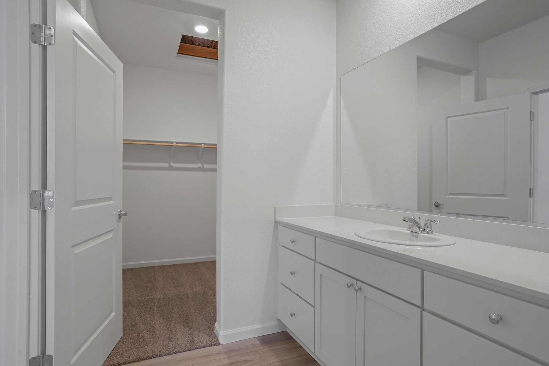 The second bedroom offers plenty of storage with a spacious walk-in closet.