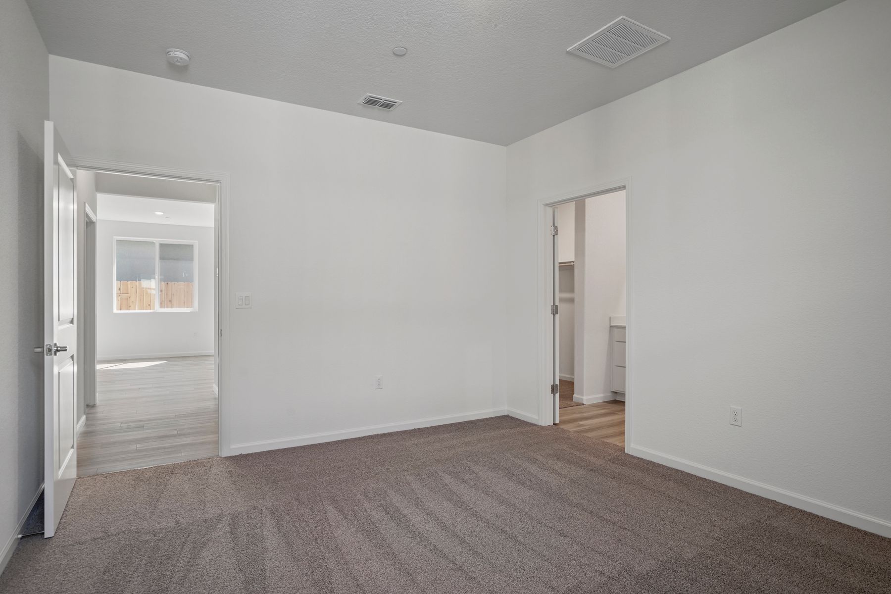 The second bedroom leads straight to the attached private bathroom.