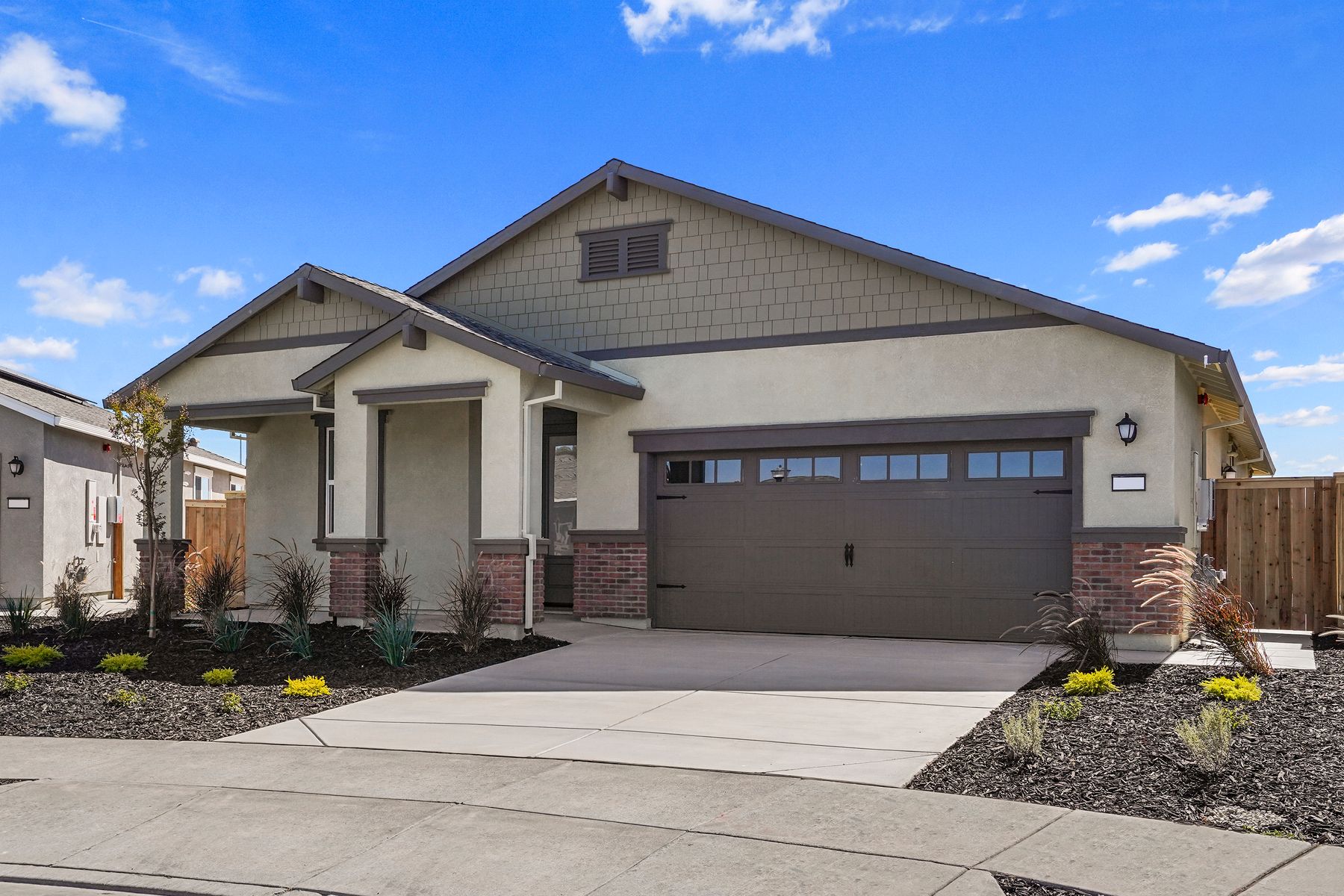 This home has a 2-car garage and gorgeous stone detailing.
