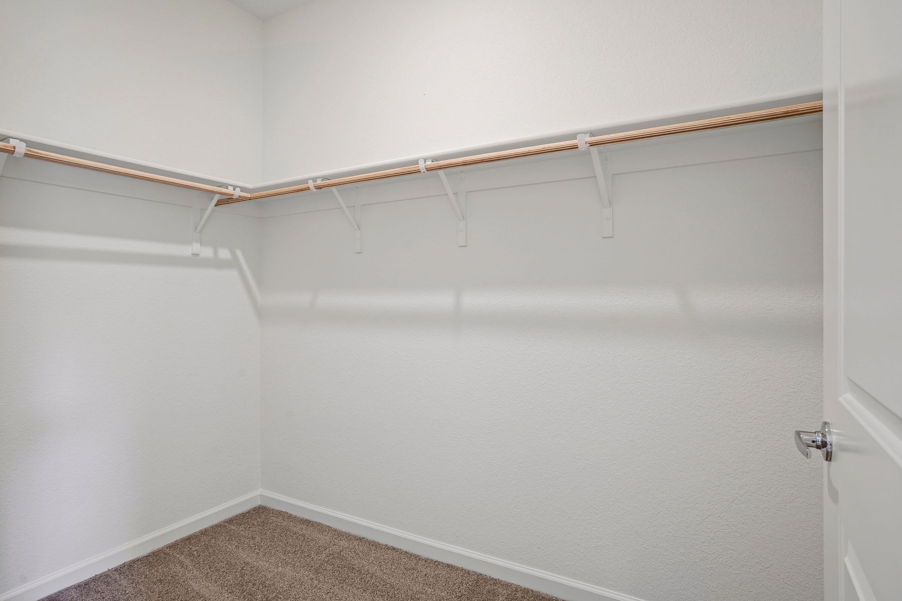 This luxurious walk-in closet is the perfect space for all of your storage needs