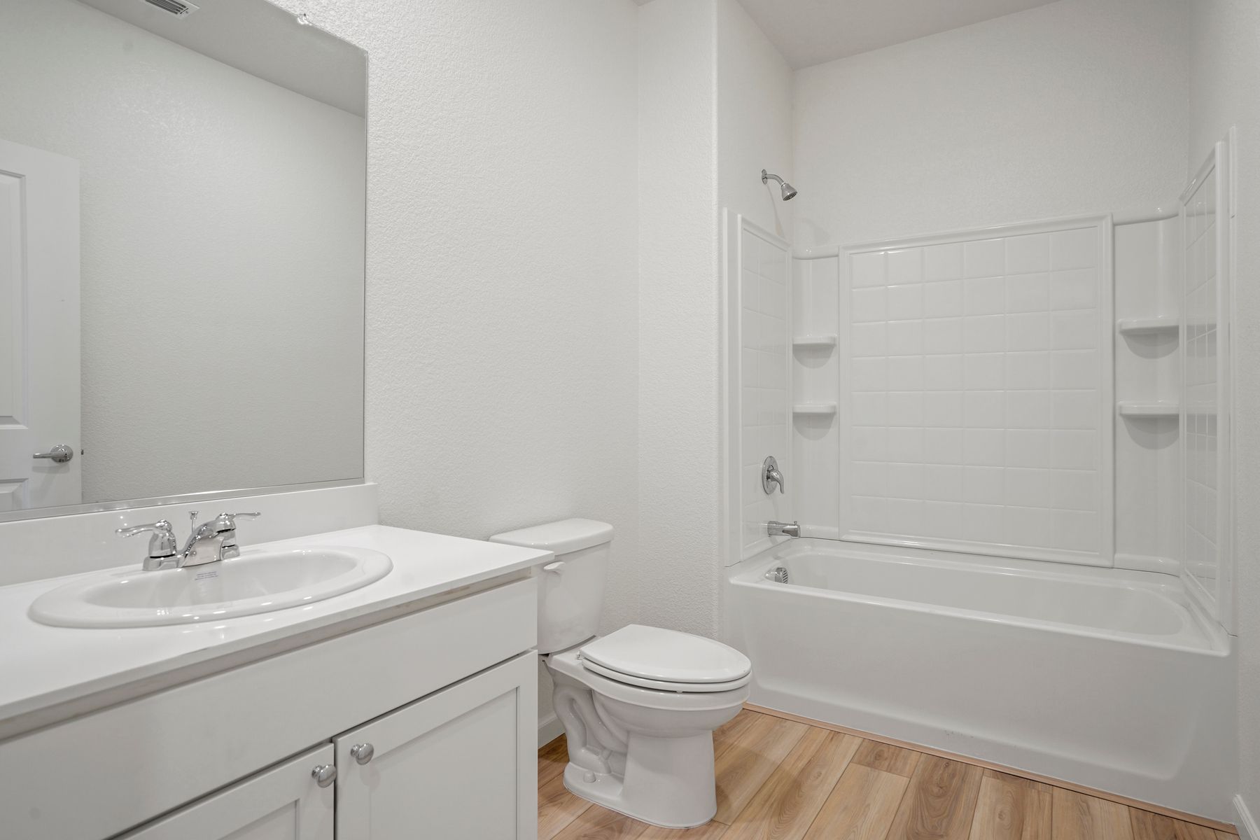 The bathroom has the perfect amount of counter top space along with a shower and bath tub combo.