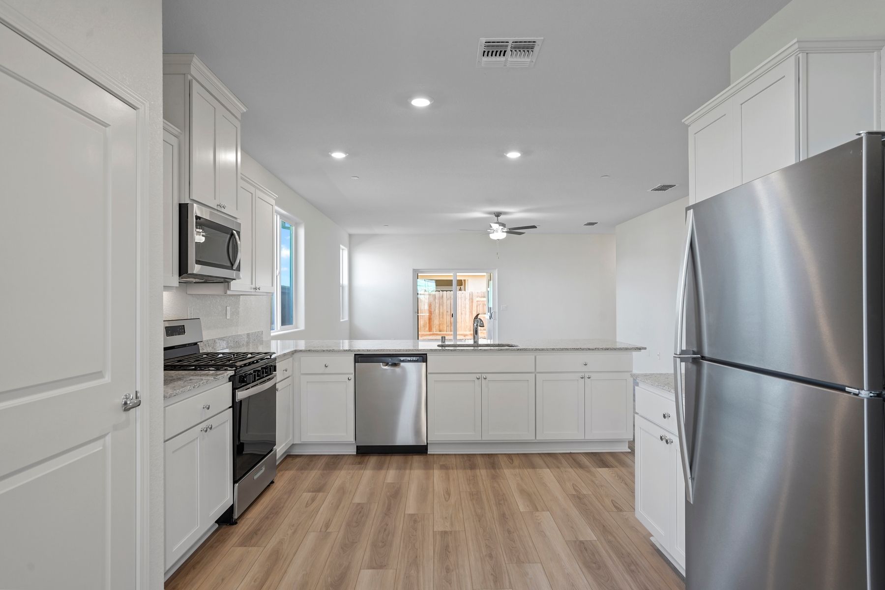 The kitchen is fit with updated appliances