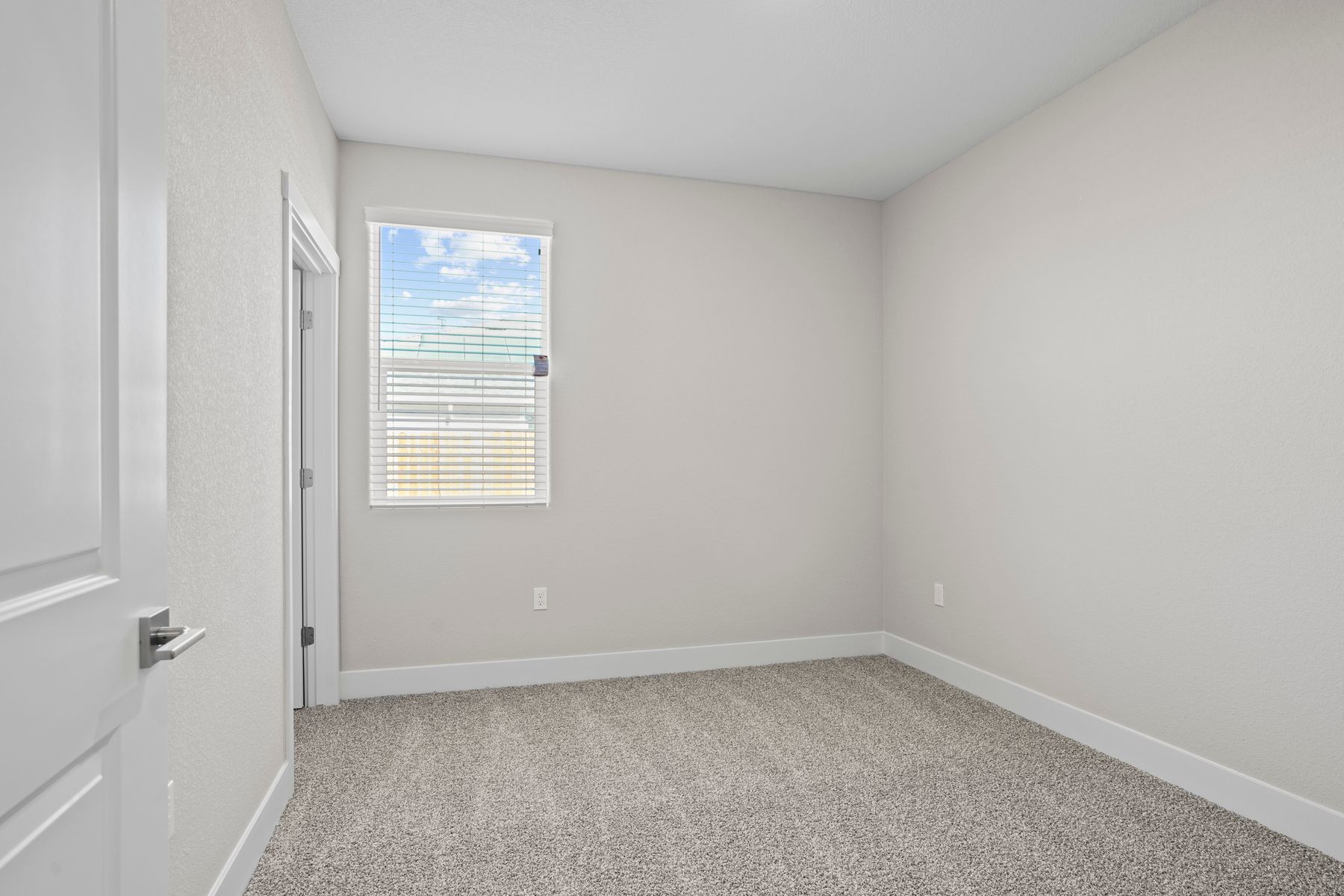 The second bedroom has beautiful natural lighting