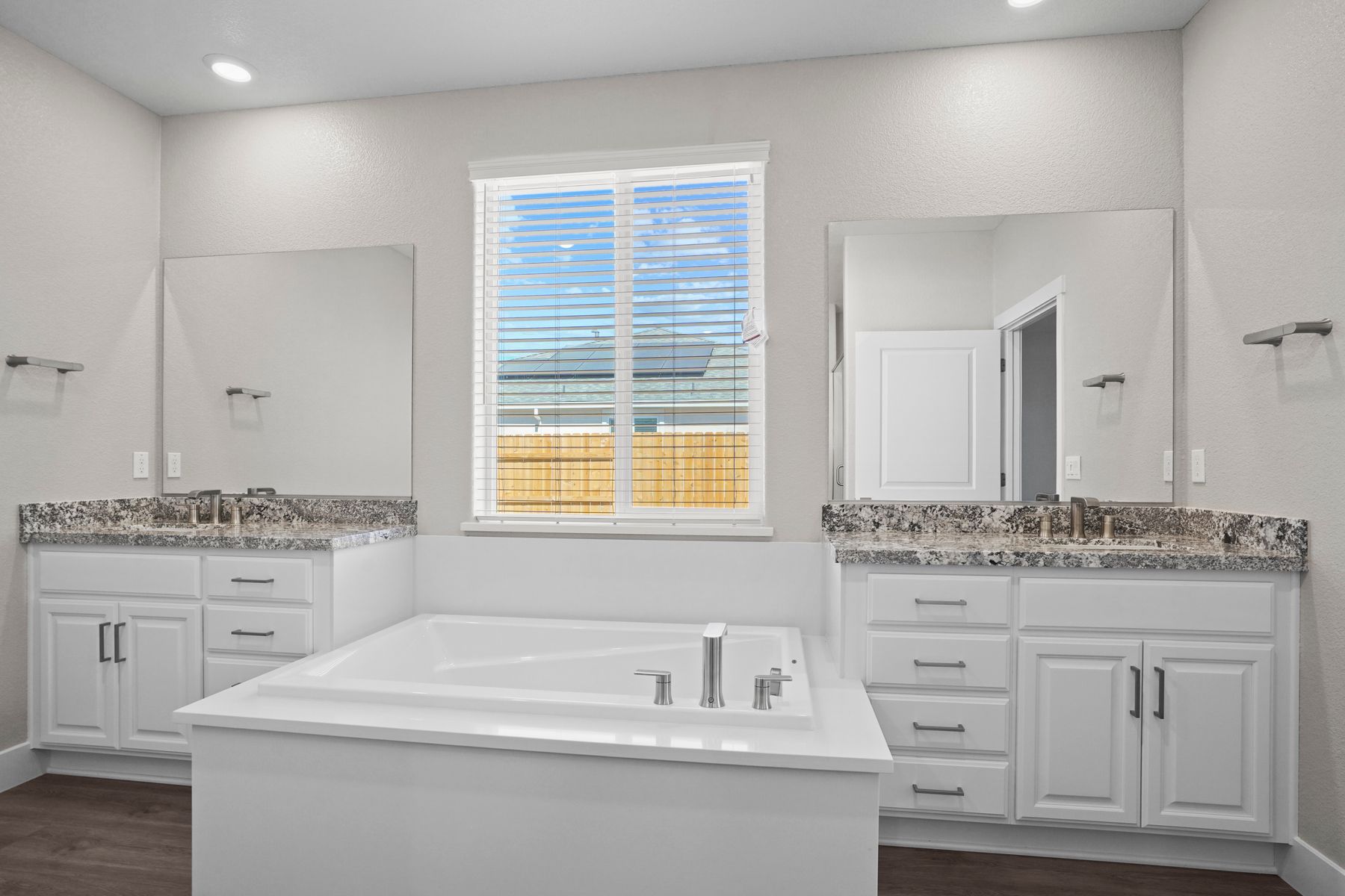 The master bathroom has double sink vanity's  