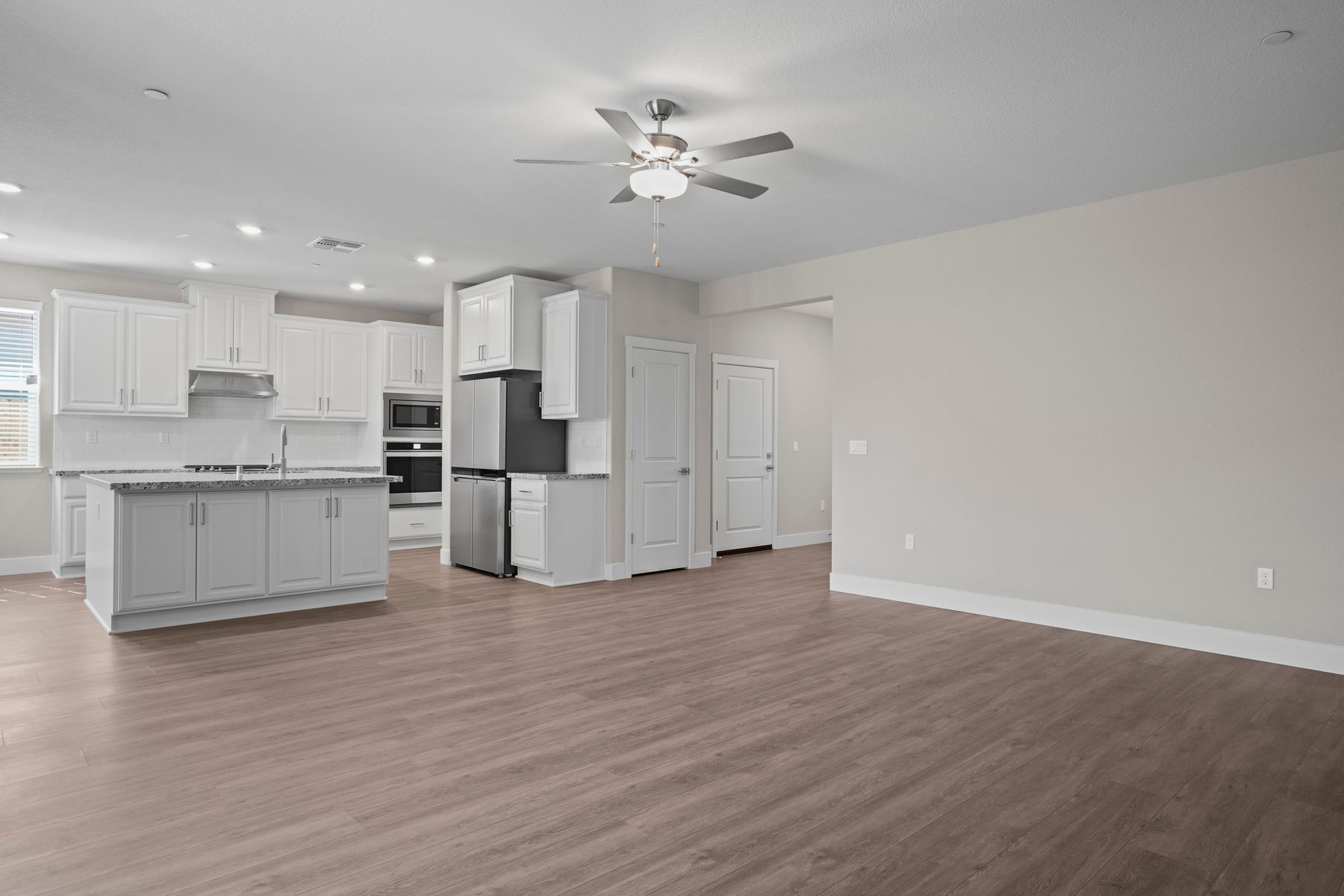 The kitchen is connected to the living room with a perfect view of the entire room
