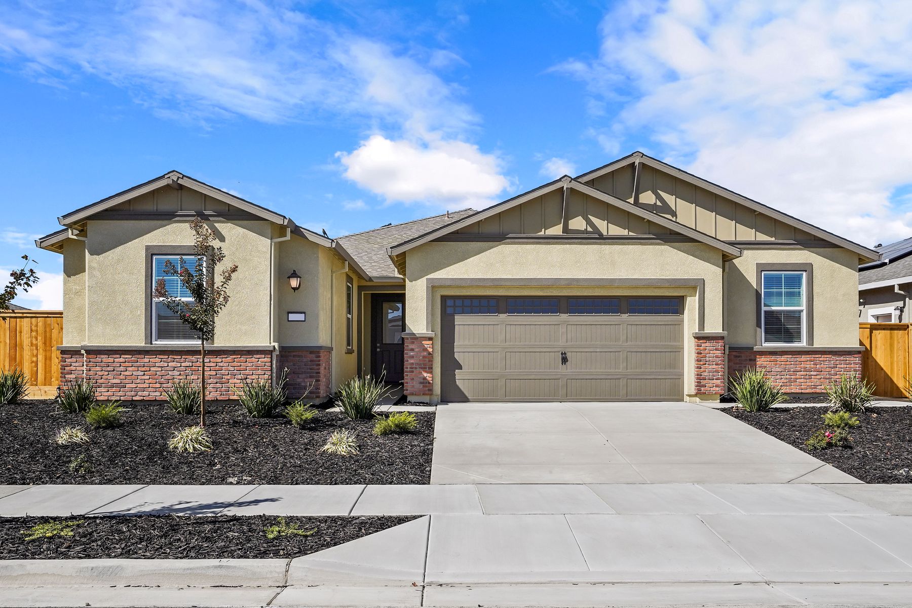 The home has a beautiful exterior with brick features
