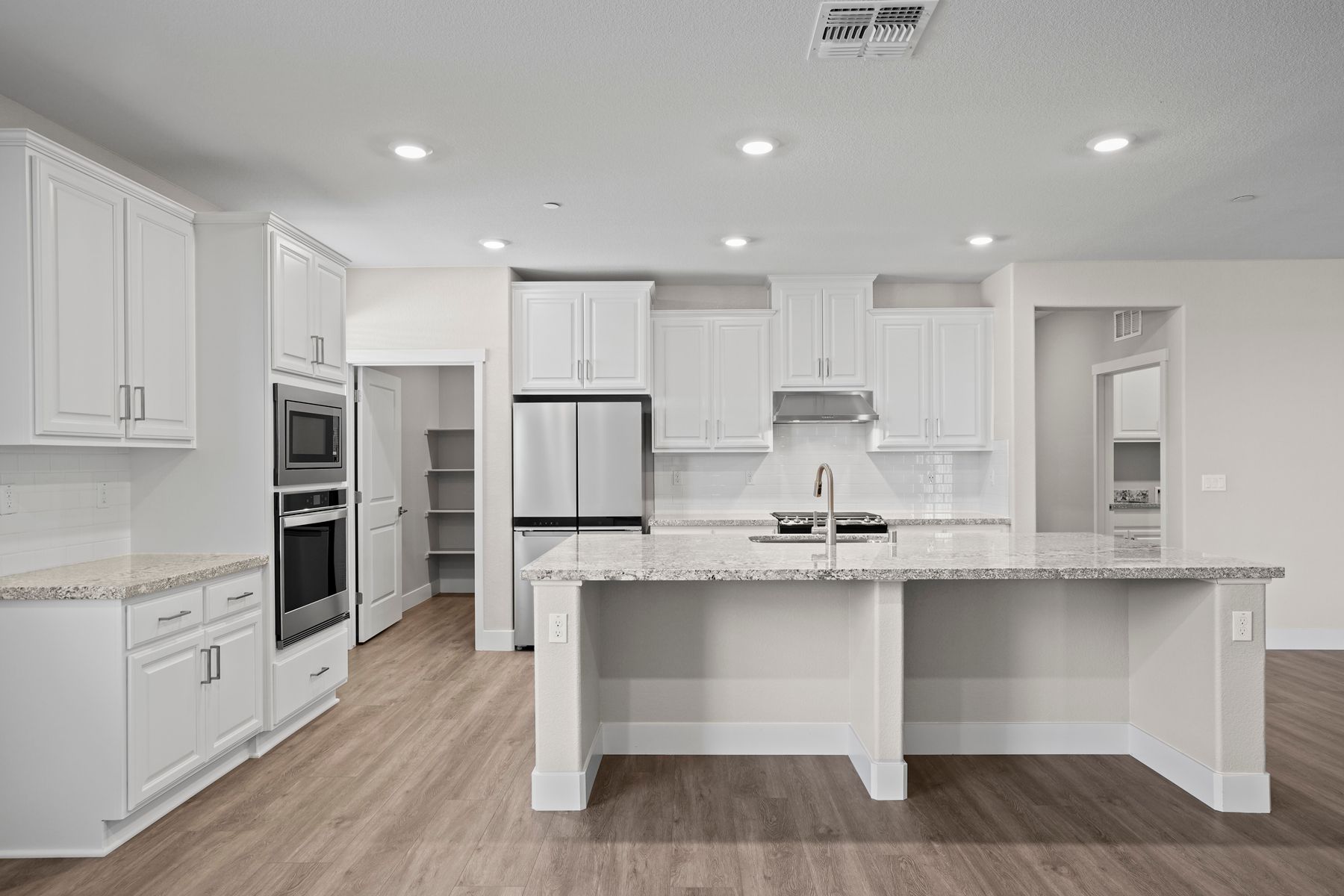 The kitchen offers ample space for cooking as well as hosting 
