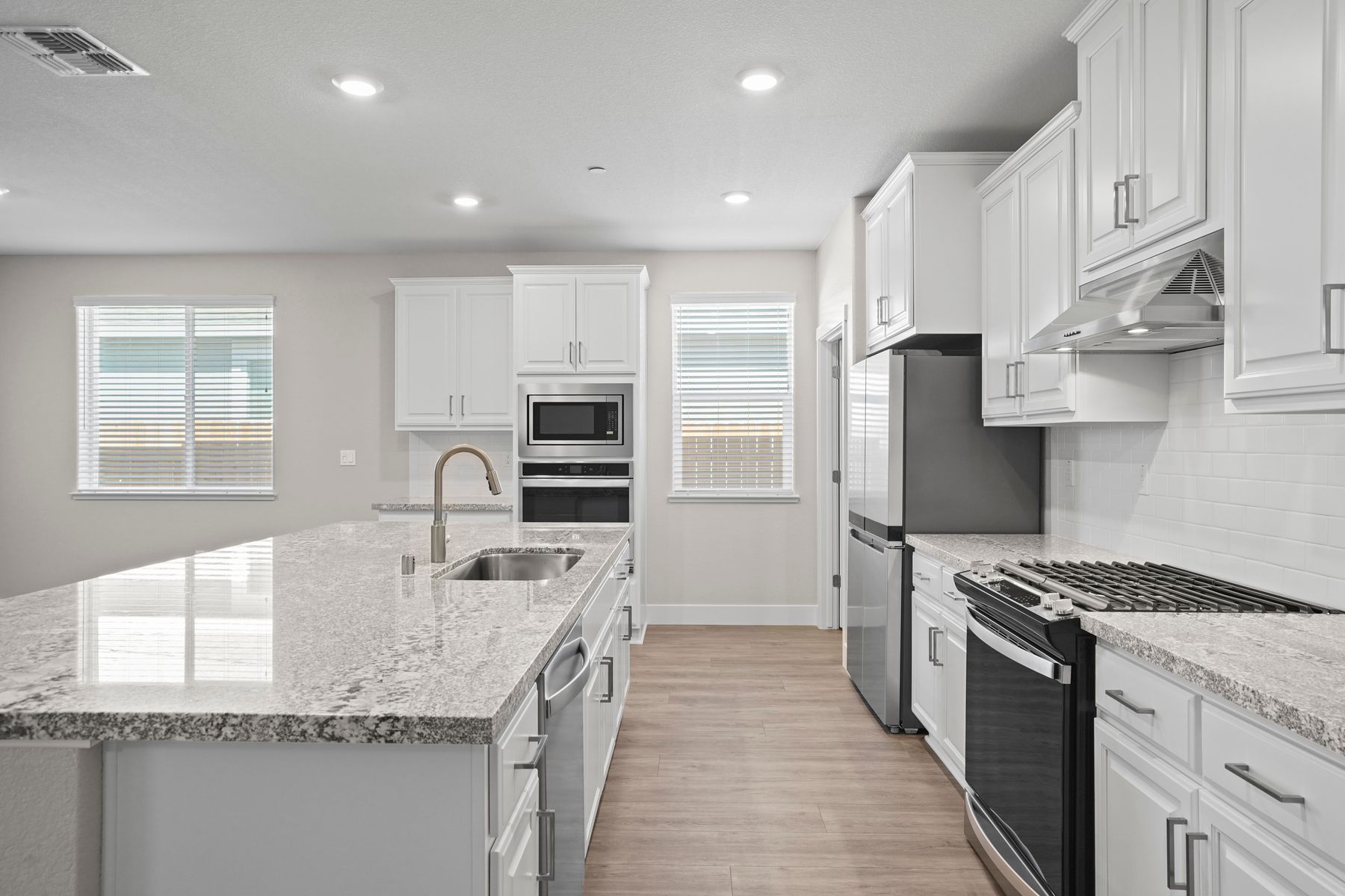 The kitchen is built with beatiful granite countertops and updated appliances