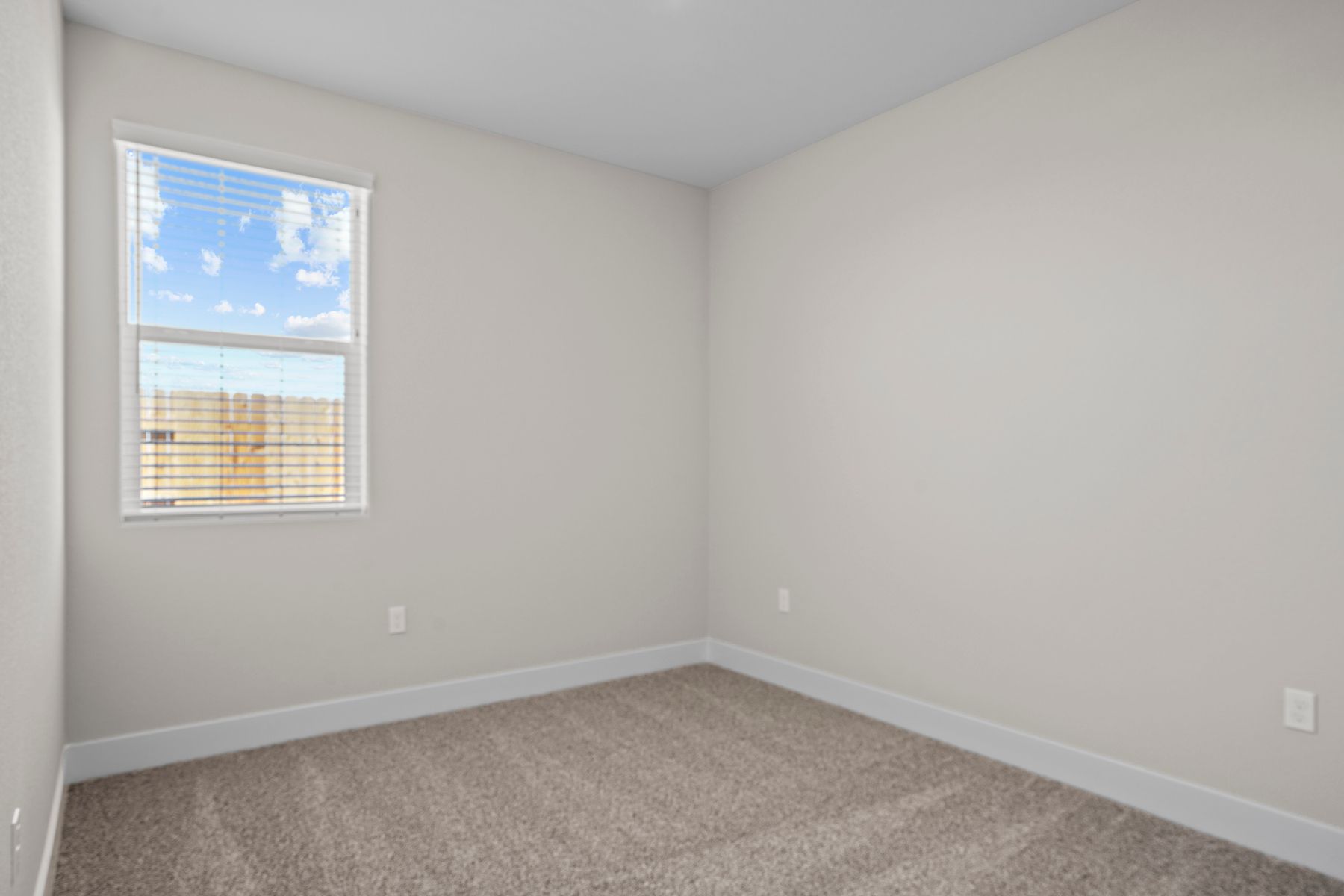 This bedroom has a lot of space suited for kin-size furniture