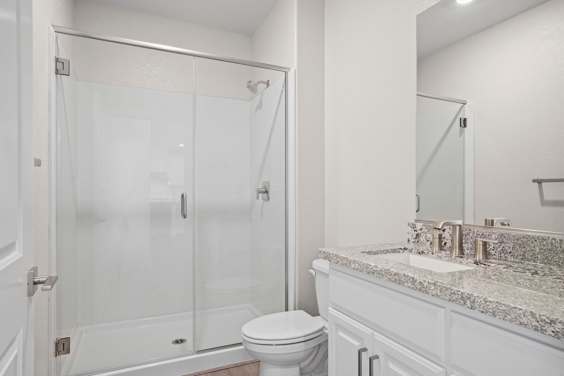 The beautiful bathrooms offers a walk-in shower and ample space