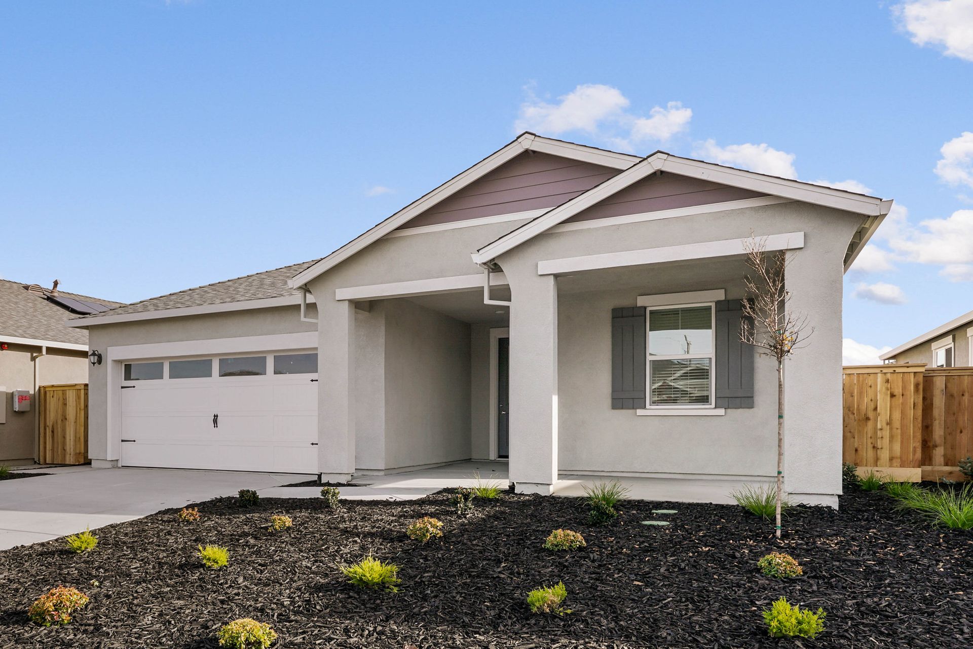 This home has a 2-car garage and a spacious front porch.