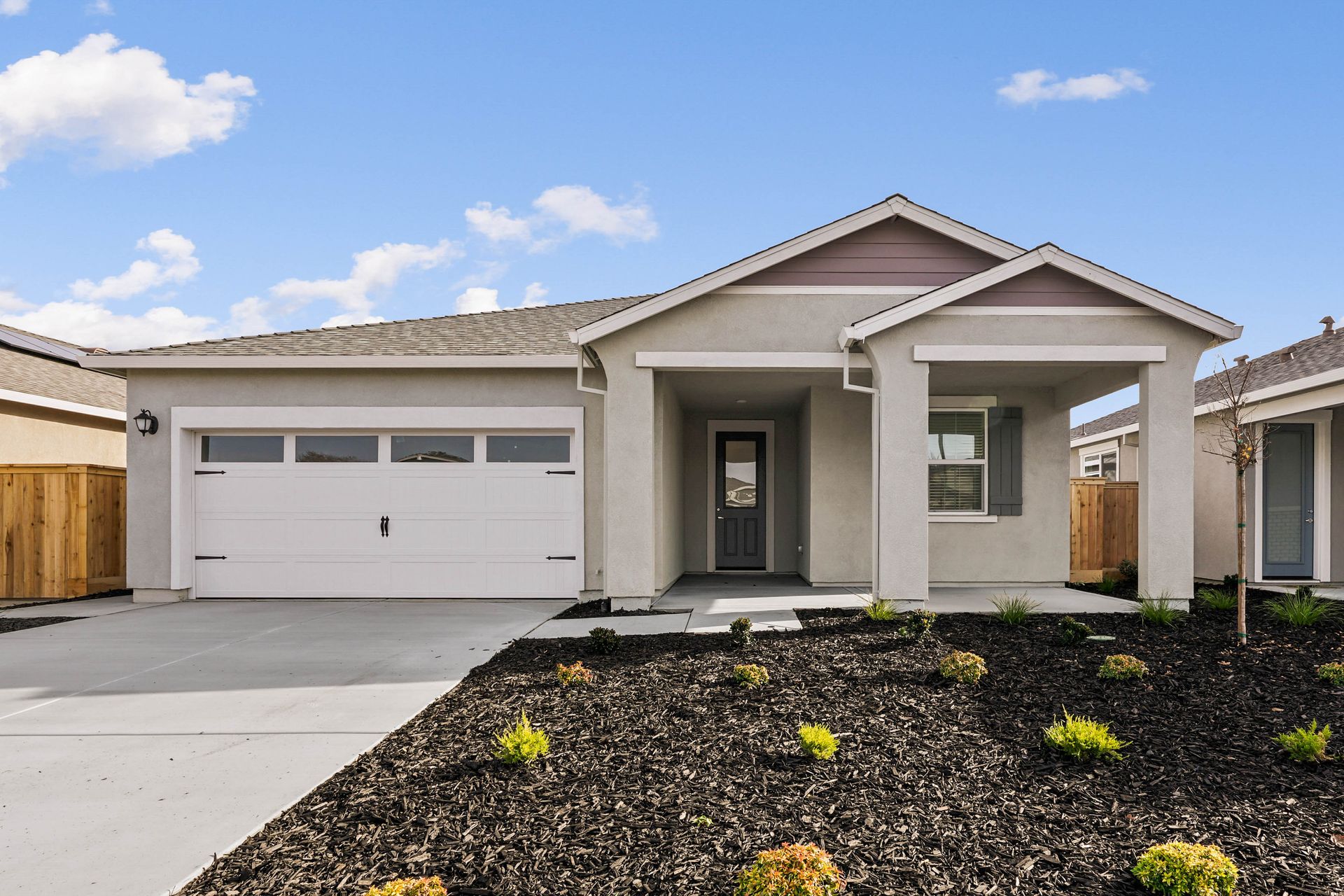You will love the professional landscaping of the Alpine plan.