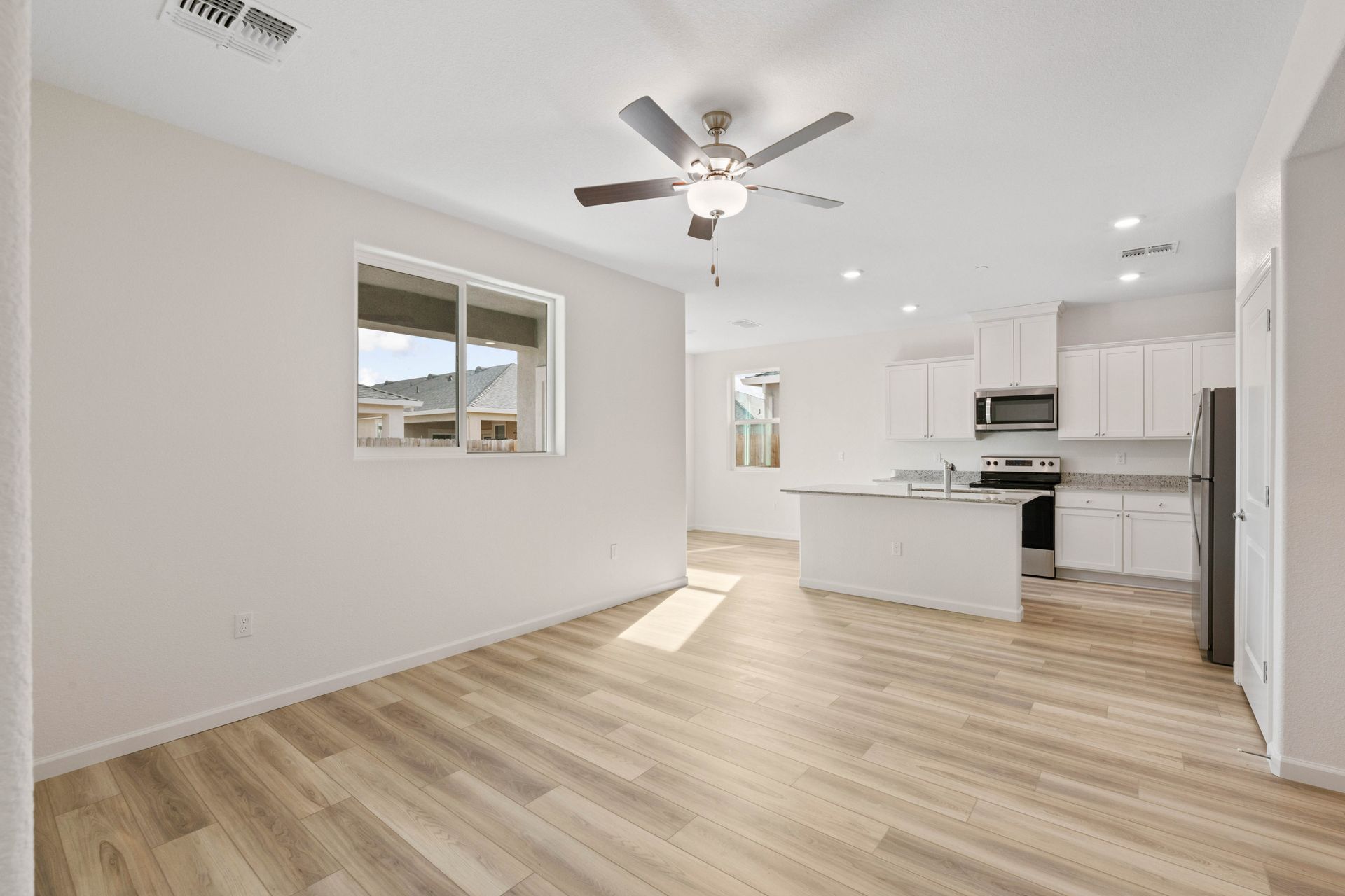 The open-concept of the living room and kitchen is perfect for hosting.