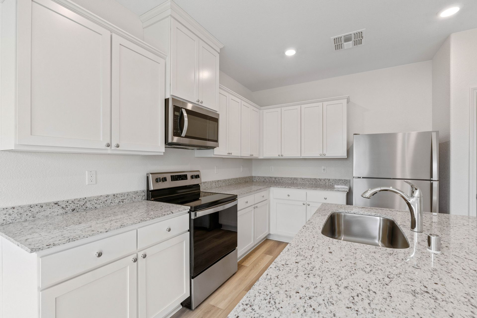 This kitchen has a full suite of stainless steel appliances.
