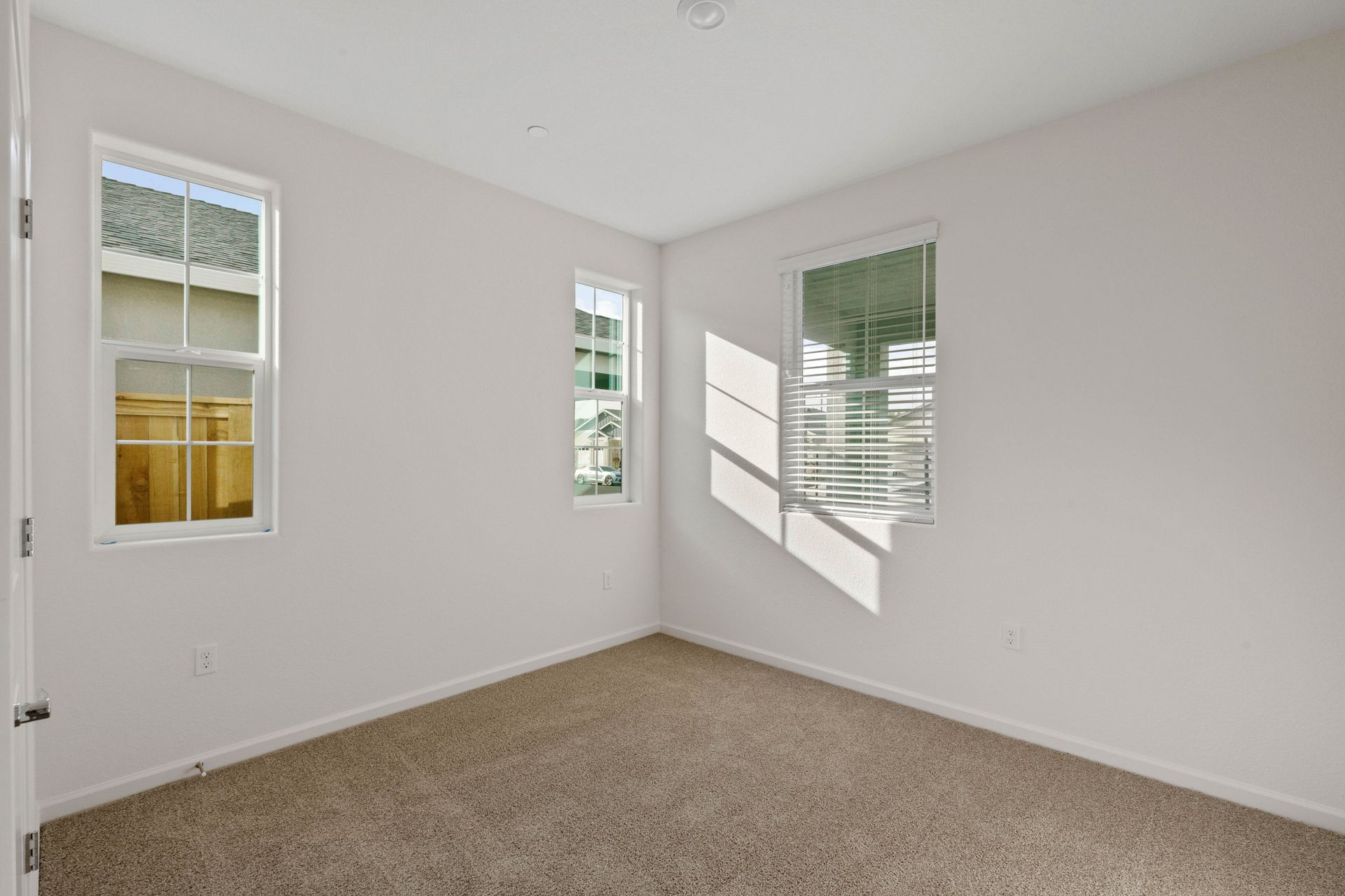 Windows let in plenty of light to this second bedroom