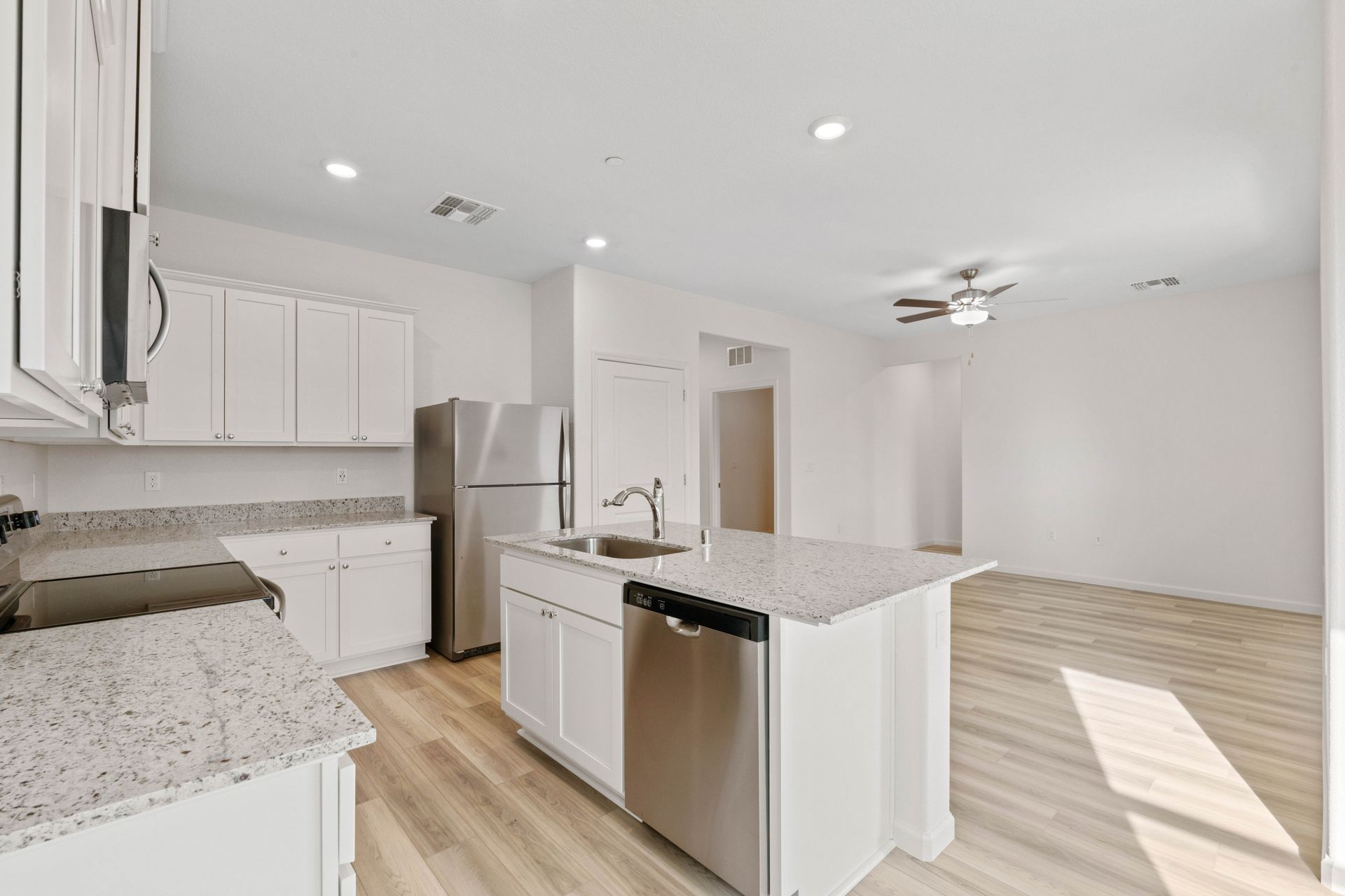 This kitchen has a beautiful granite island.