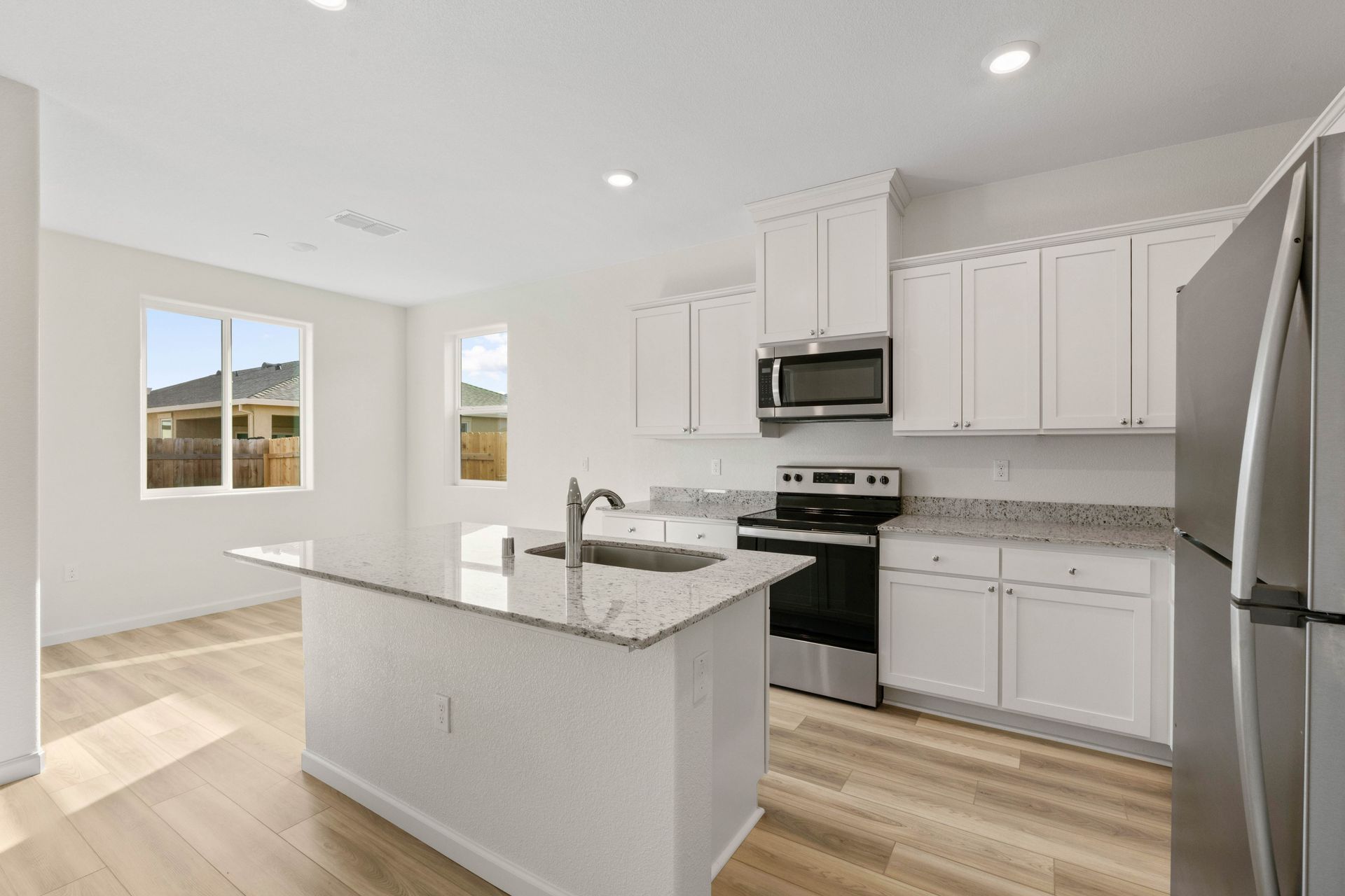 The kitchen lets in an abundnance of natural light.