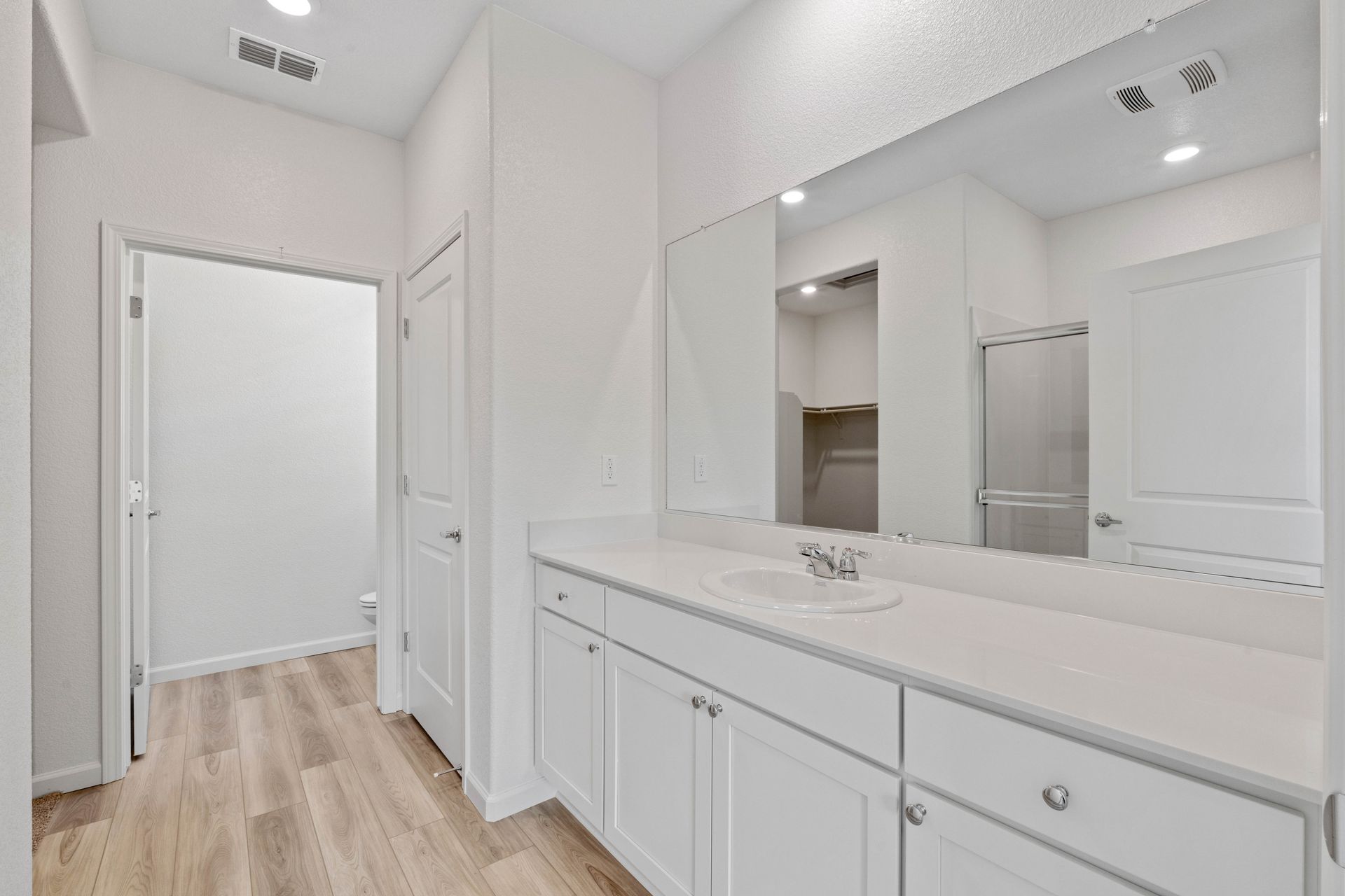 The master bath has a private commode and tons of drawer space.