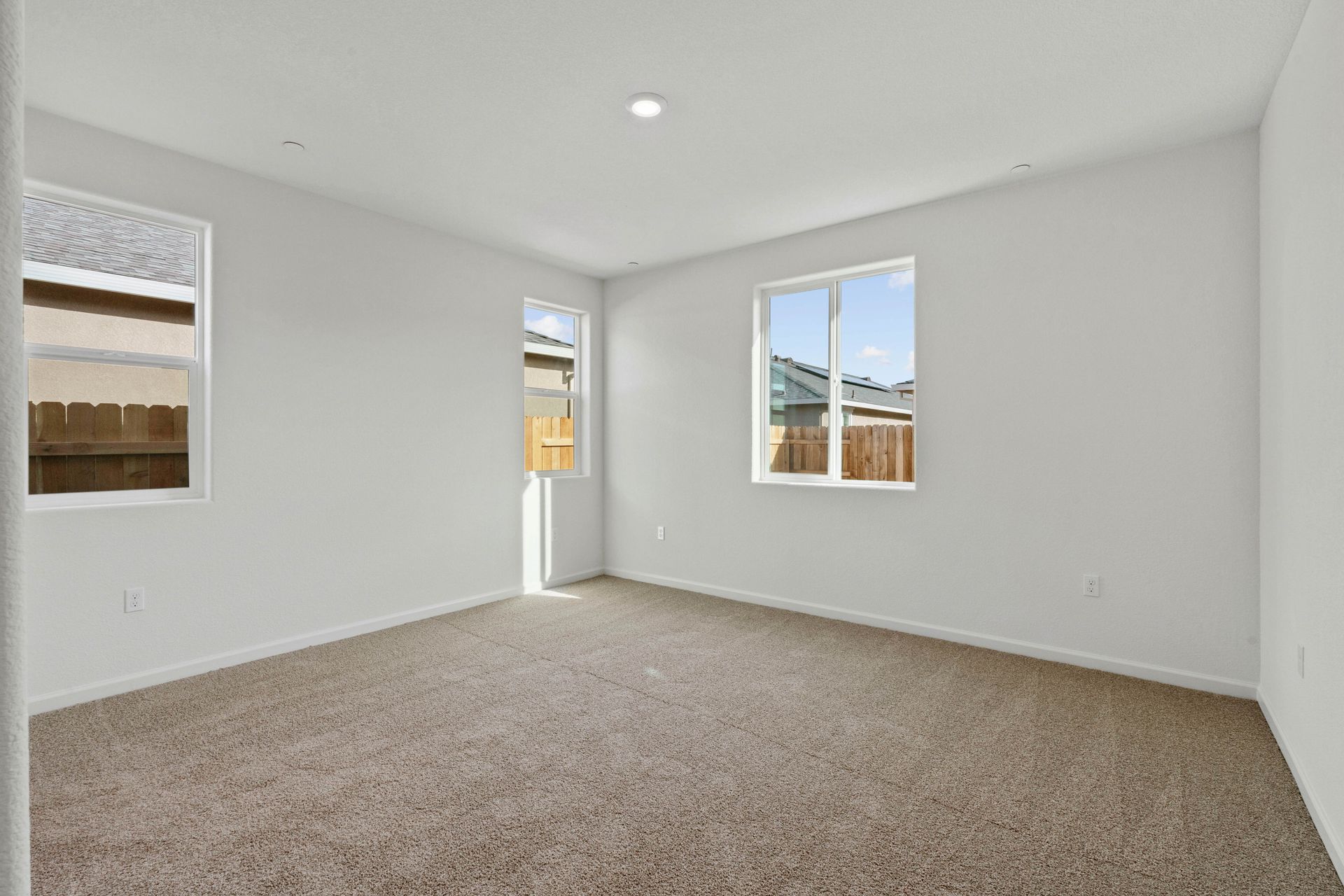 The master suite of this home has plenty of space for your king-sized furniture.