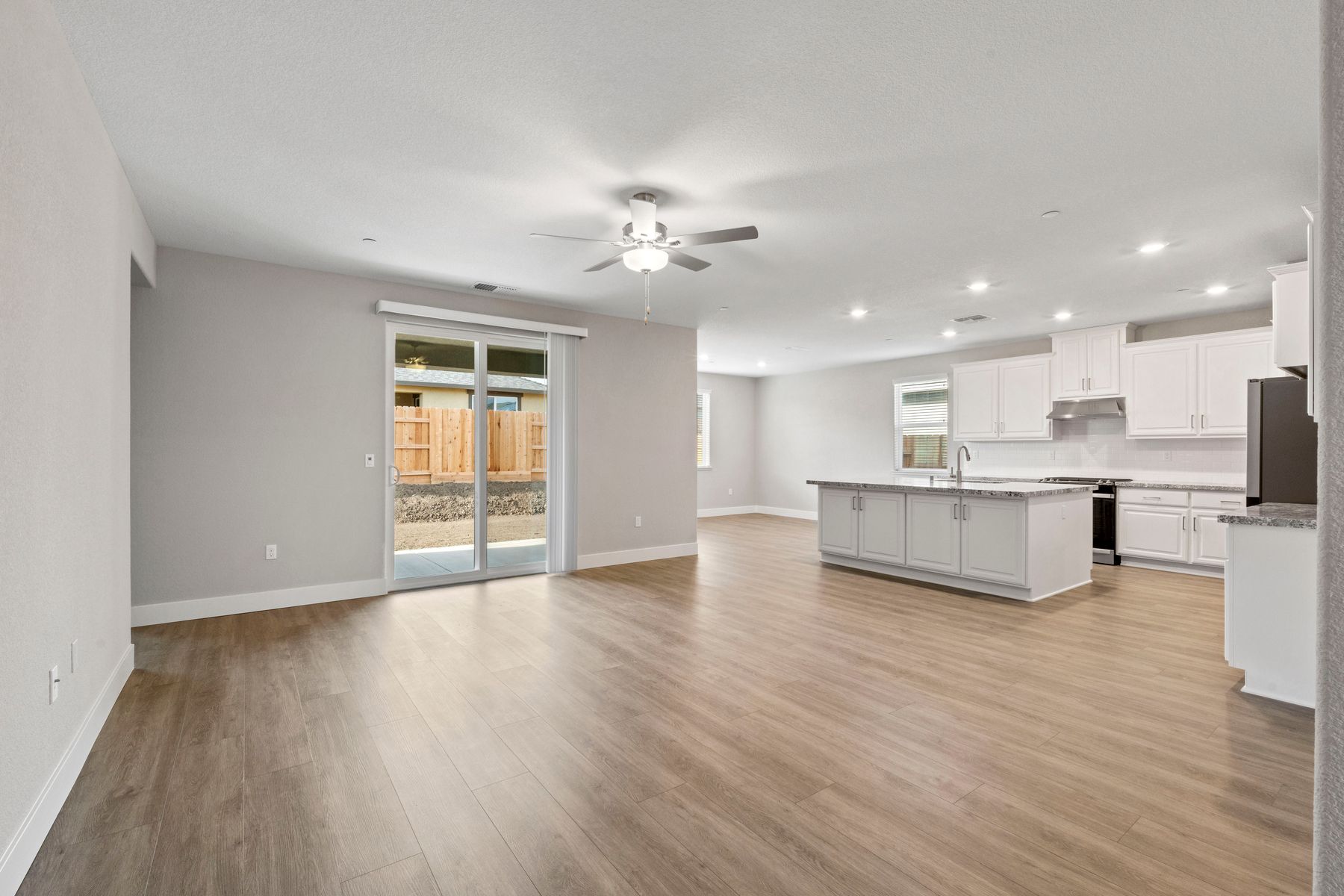 The kitchen overlooks the spacious living area.