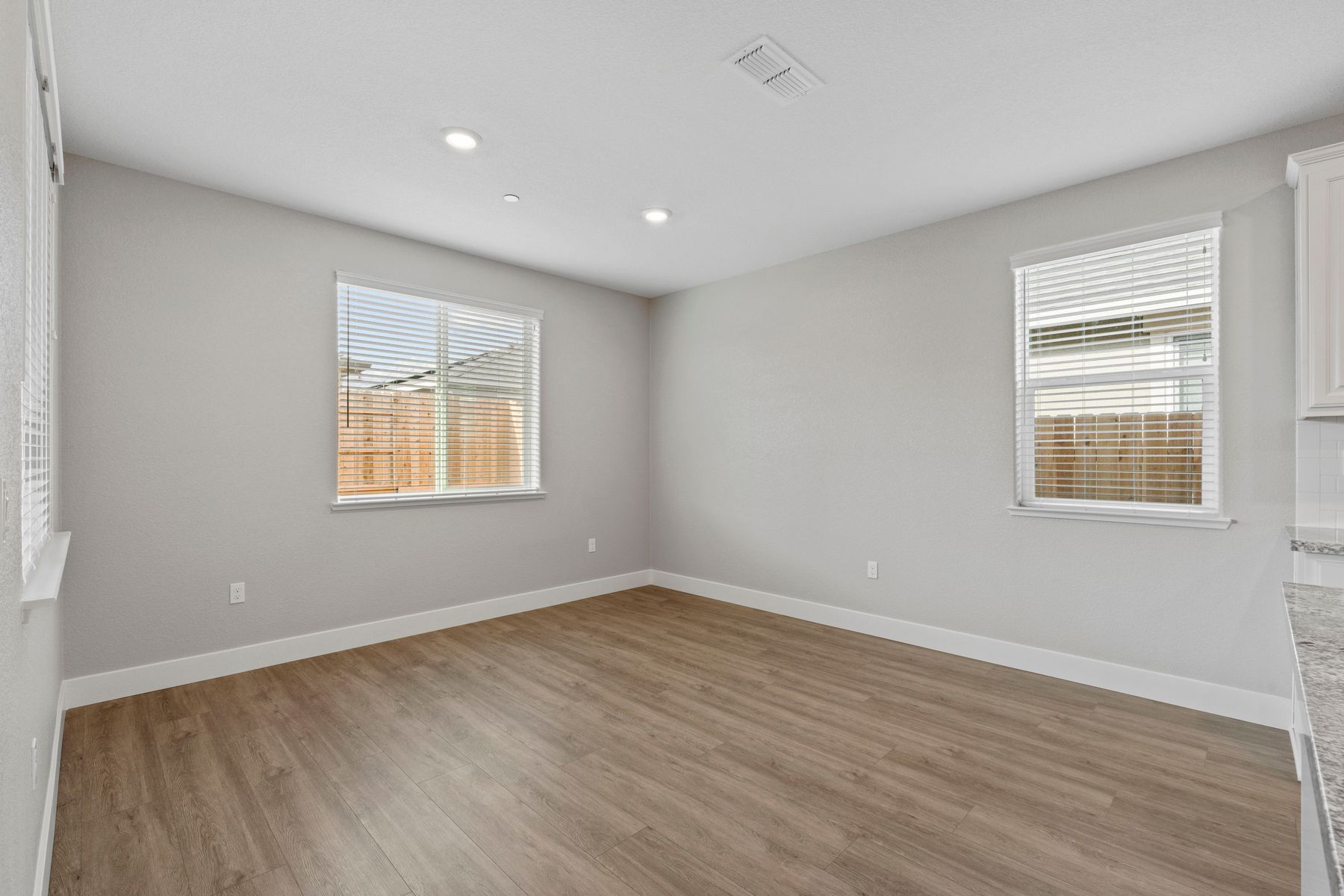 The dining room is open to the kitchen and family room.