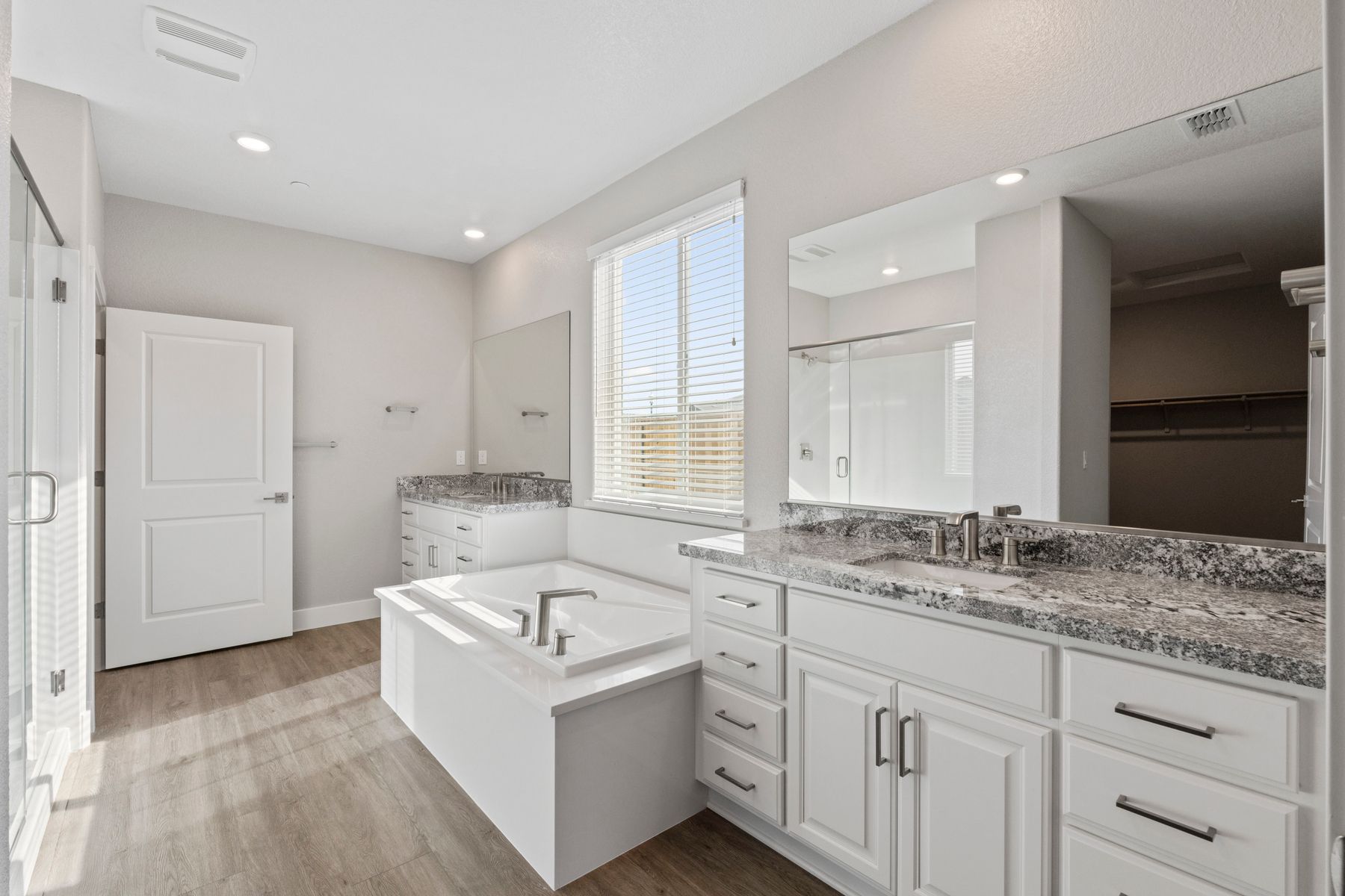 The master bath has a large soaker tub and separate shower.