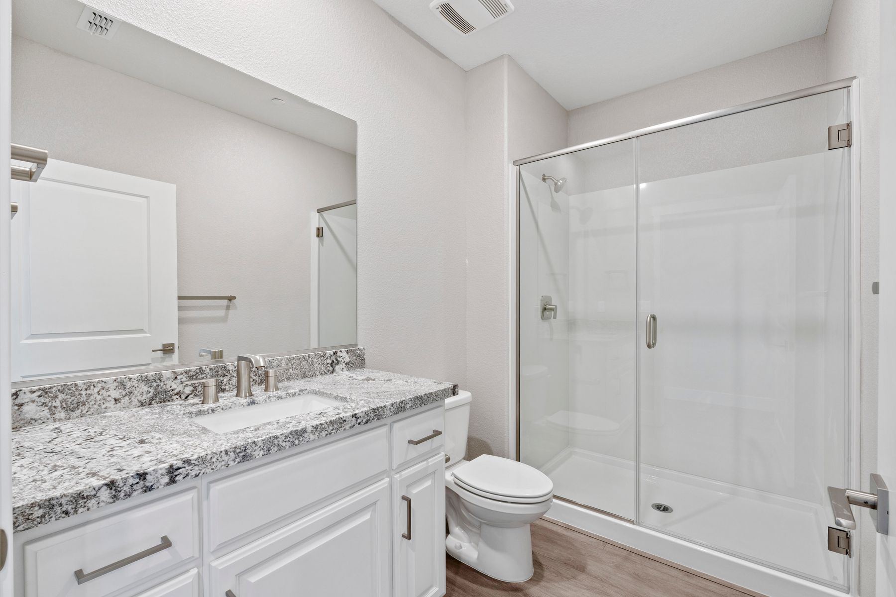Here is the secondary bathroom with a beautiful vanity.