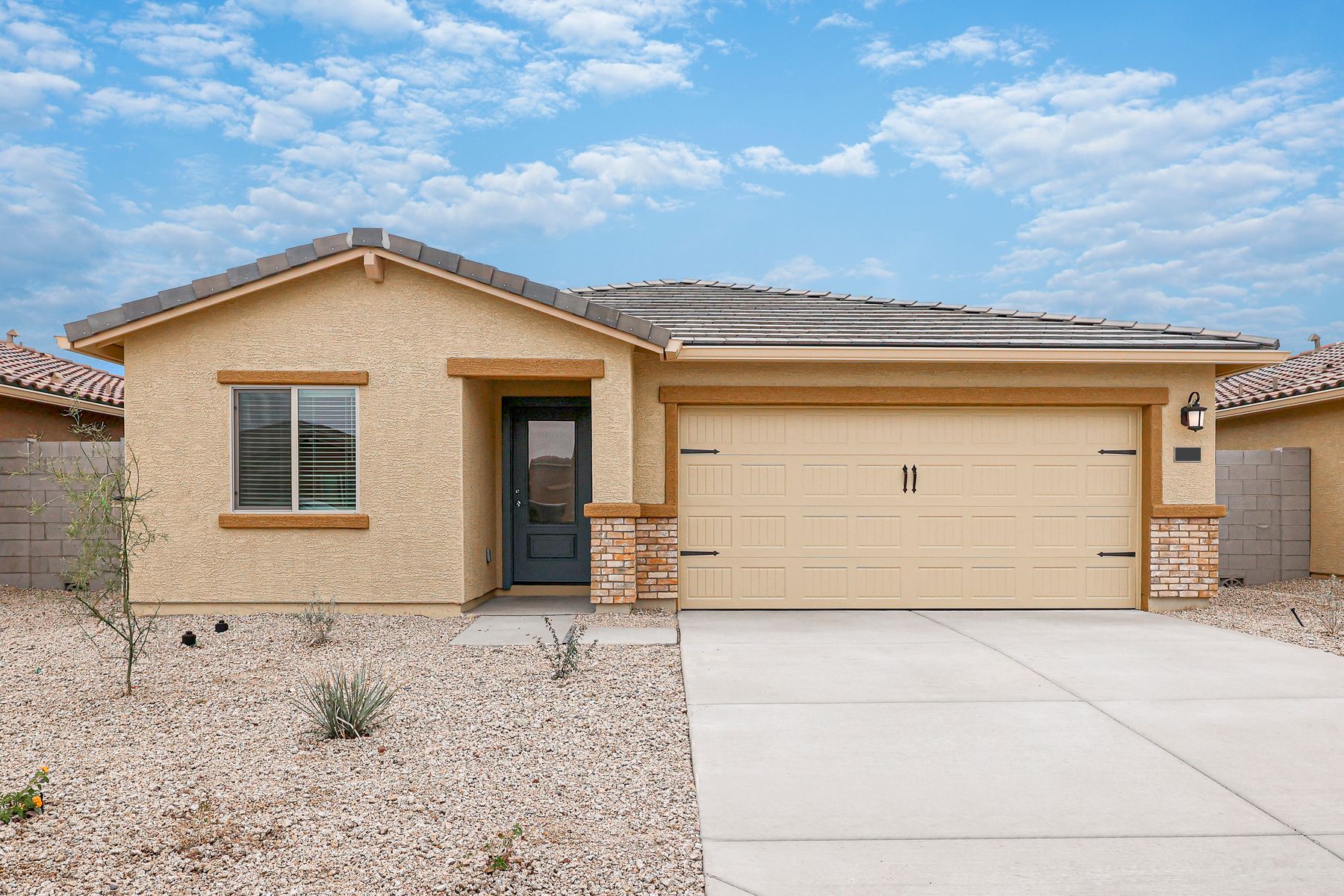 This home has a 2-car garage and gorgeous stone detailing.