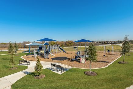 The playground at Retreat at Fossil Creek includes swing, slides, benches and more!