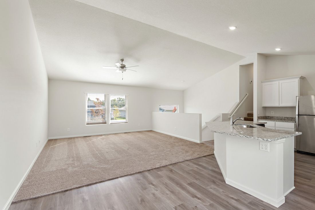 The family room is spacious and is right off of the kitchen.